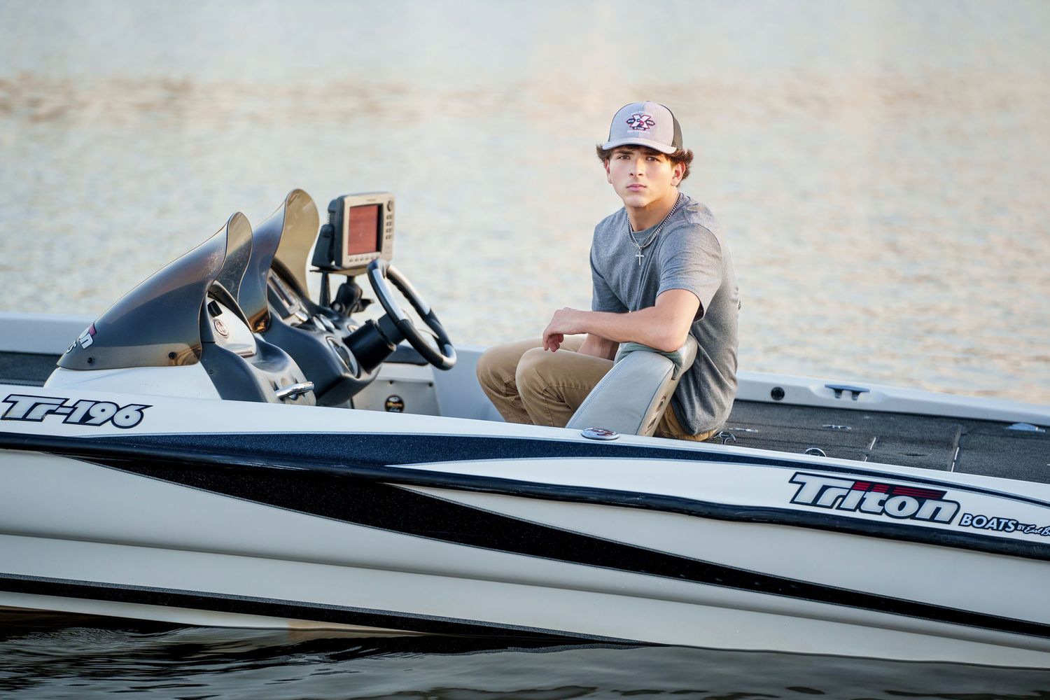 senior guy photos in the woodlands.  fishing team, lake senior photos, fishing senior photos