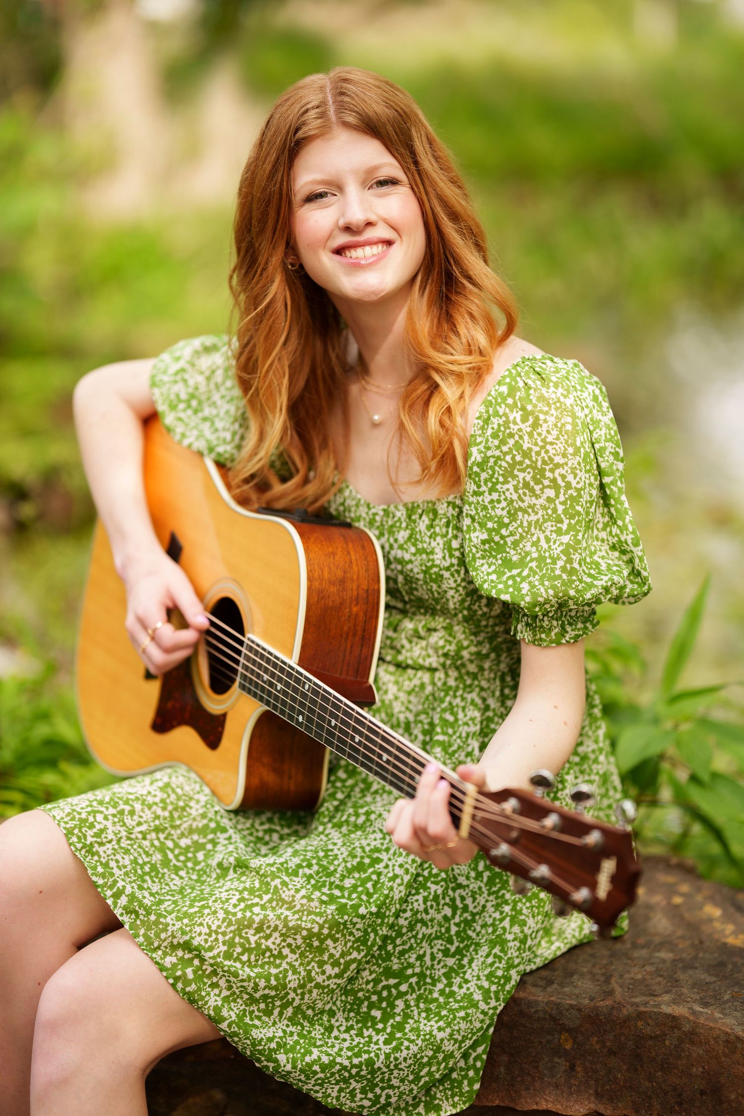 senior girl playing guitar