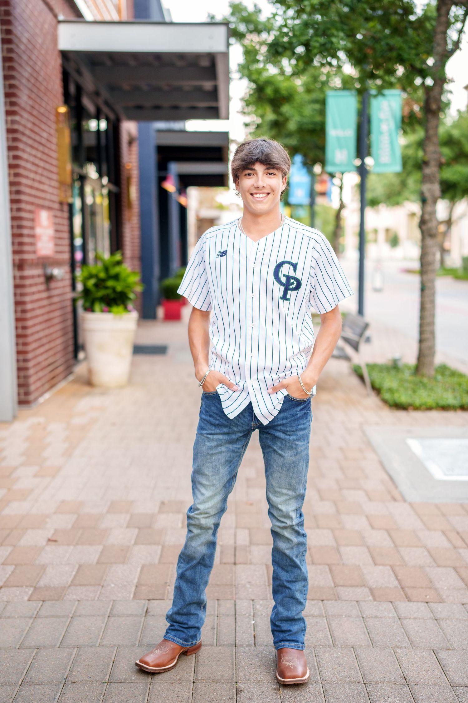 senior photos in the woodlands with a baseball player