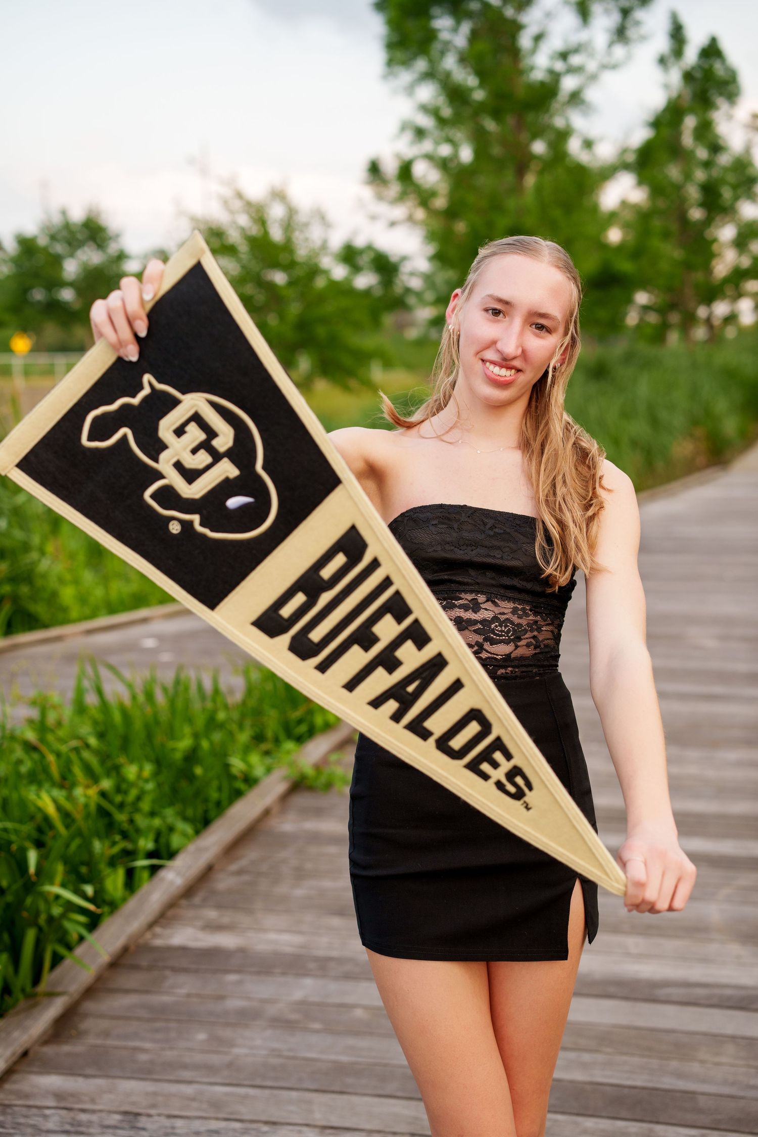 senior girl with college pennant