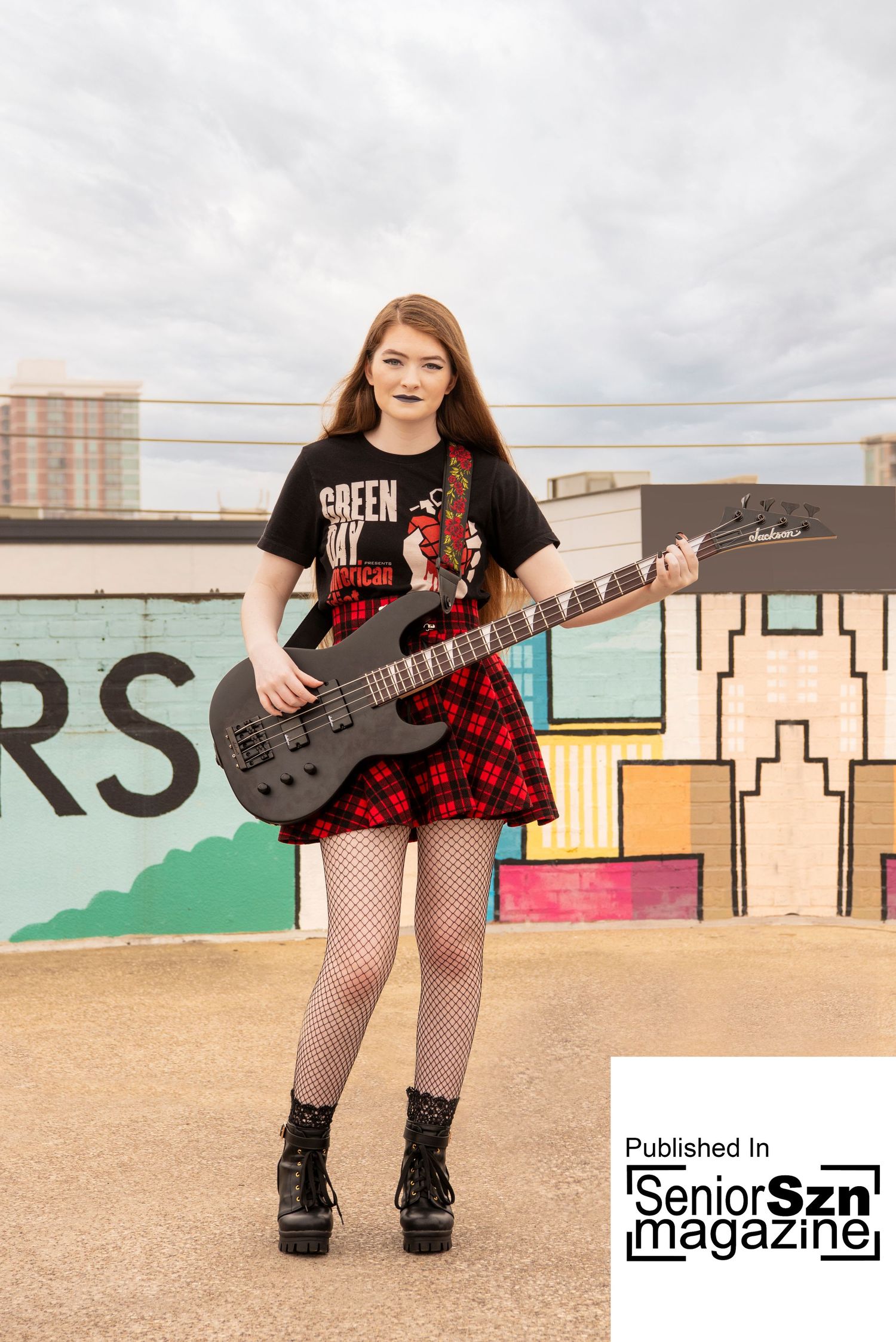 The Woodlands senior photography for girls.  Senior girl rocker photos on a rooftop with graffiti