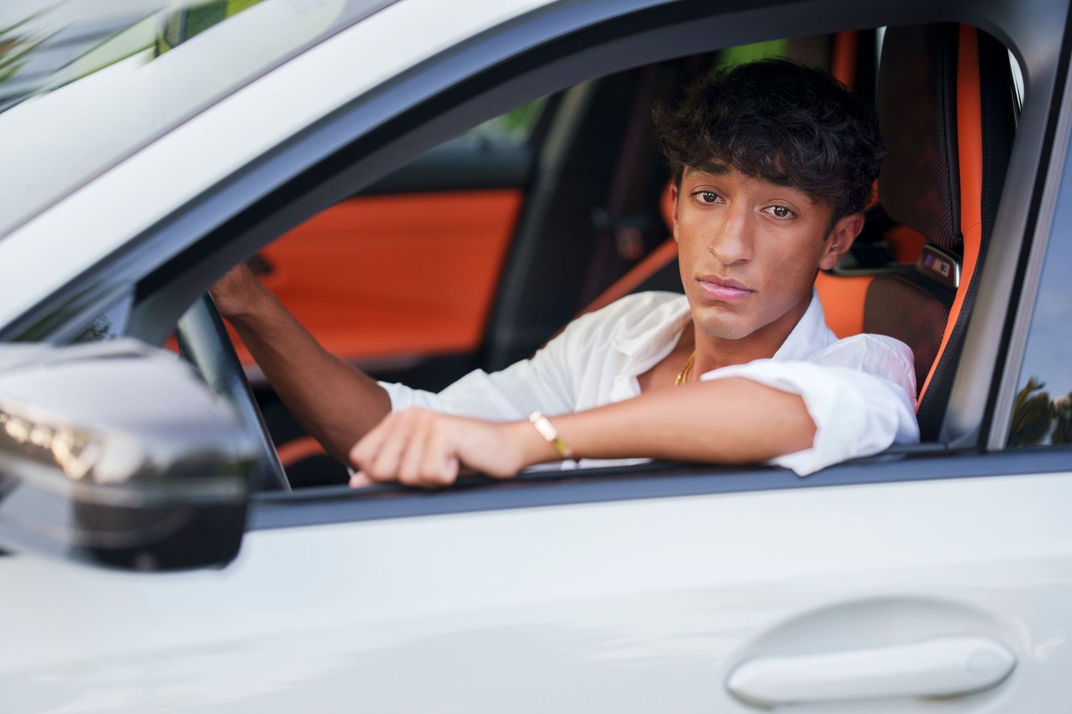 senior with sports car