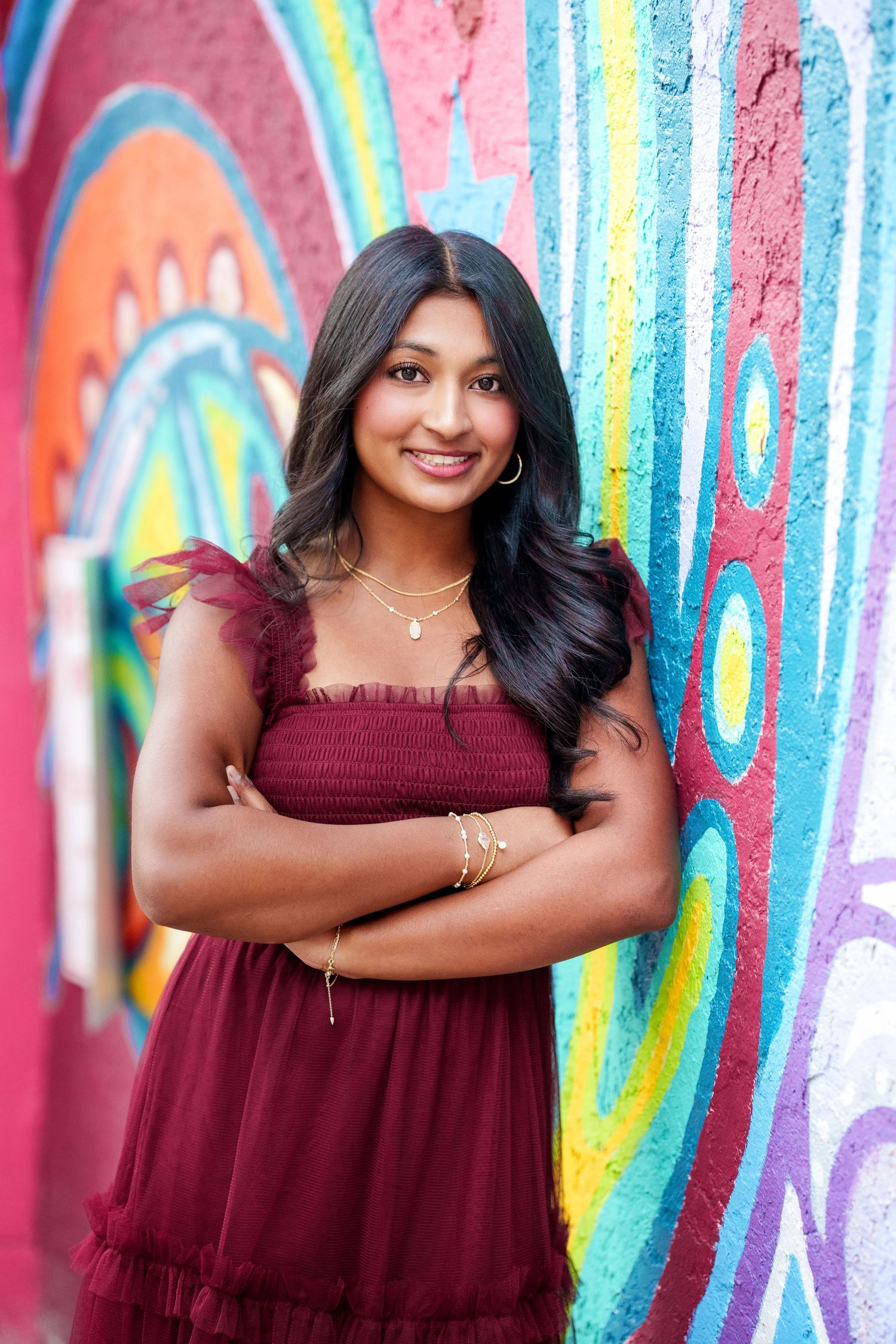 senior girl with grafittii wall