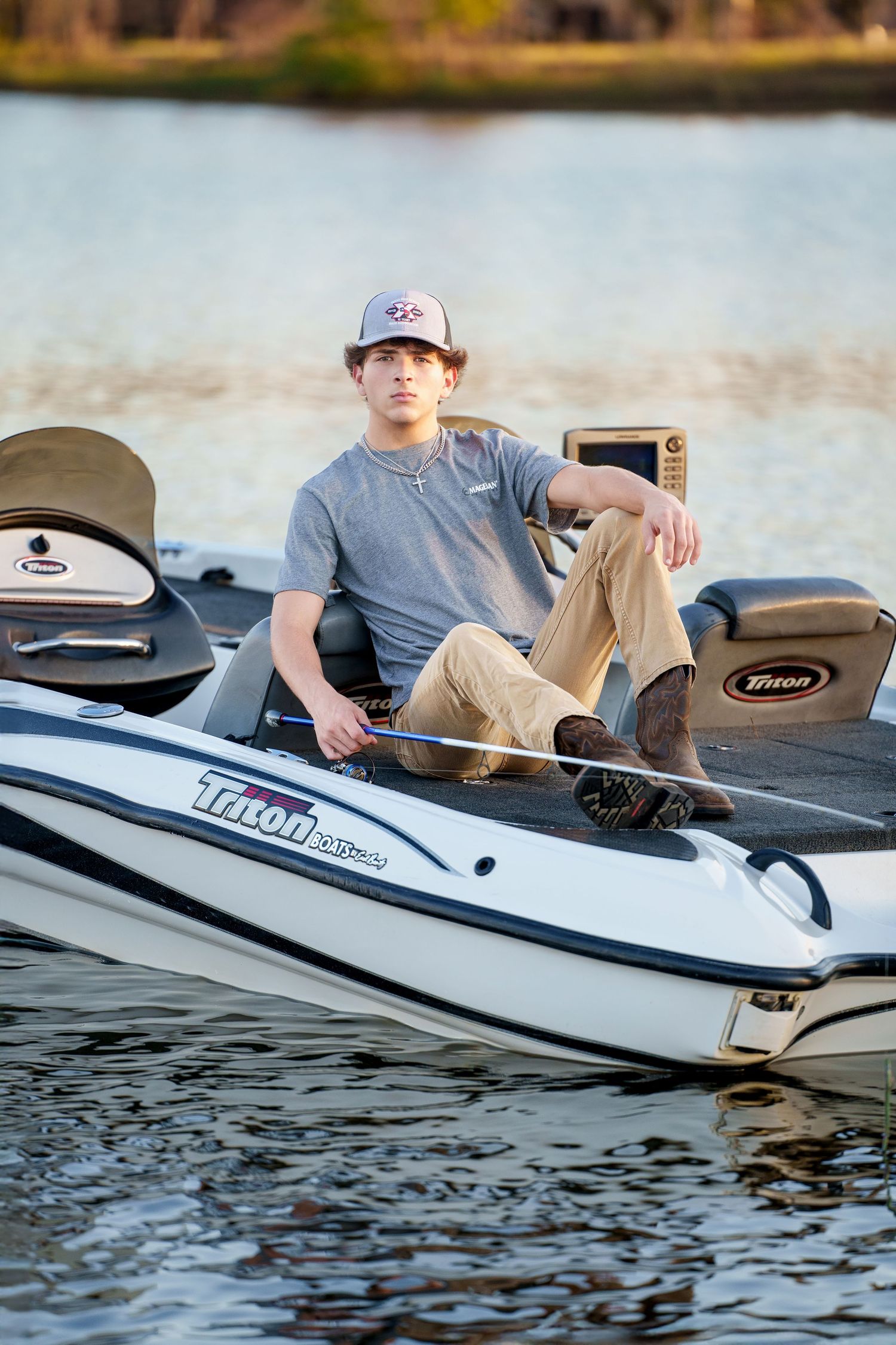 The Woodlands Senior Photographer.  Senior guy photos in the Woodlands.  Senior fishing boat photos