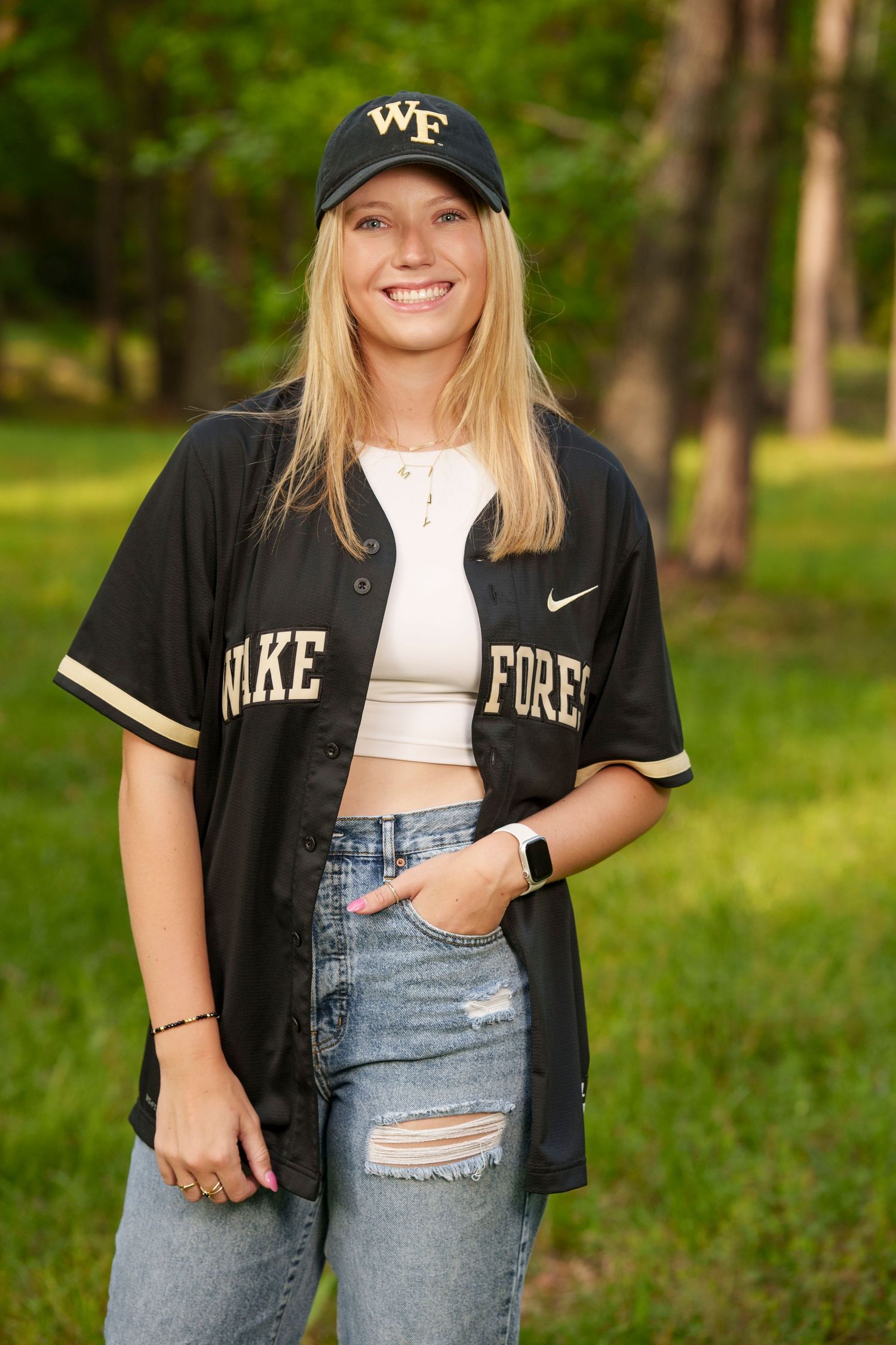 Softball college reveal images.  Posing with college gear for senior photos.  The woodlands senior photographer college session