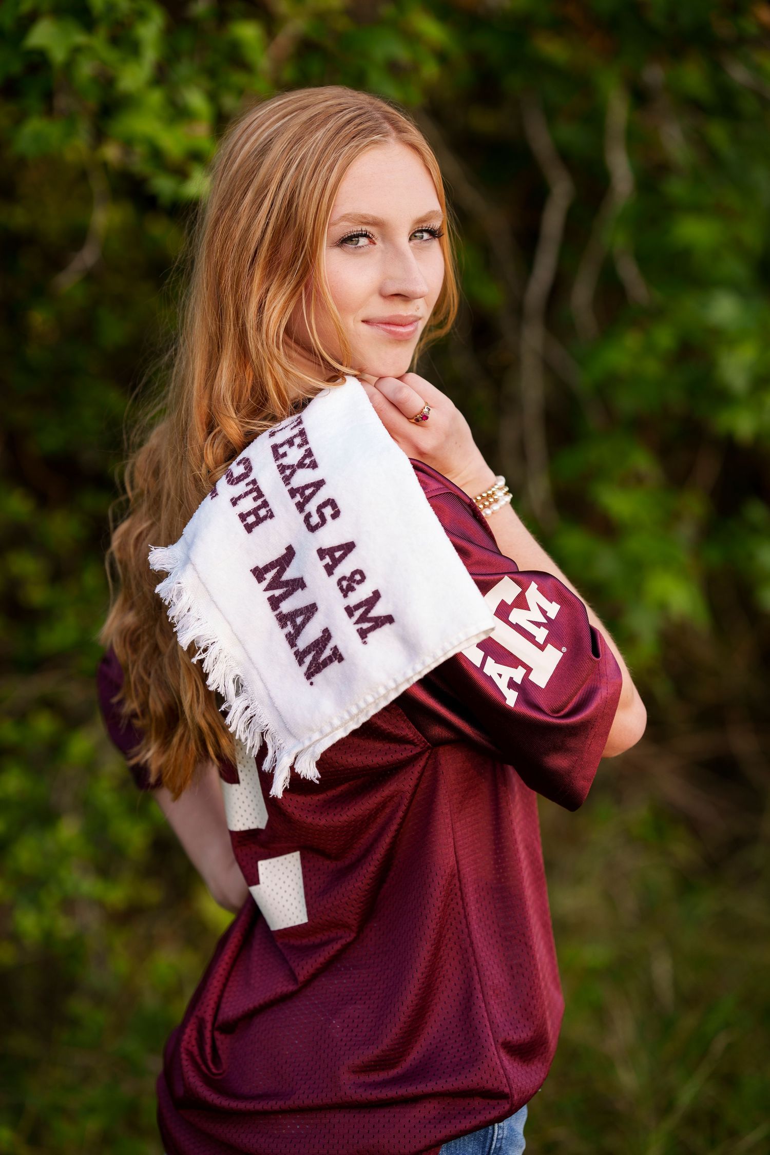 TAMU college reveal images.  Posing with college gear for senior photos.  The woodlands senior photographer college session