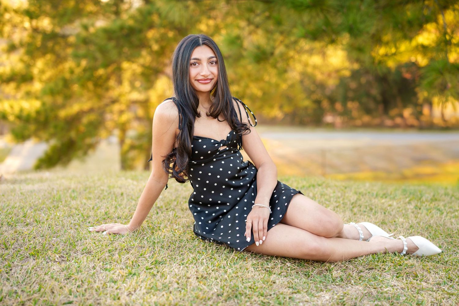 houston senior photos in a park.  the woodlands senior photographer with a girl in a short dress