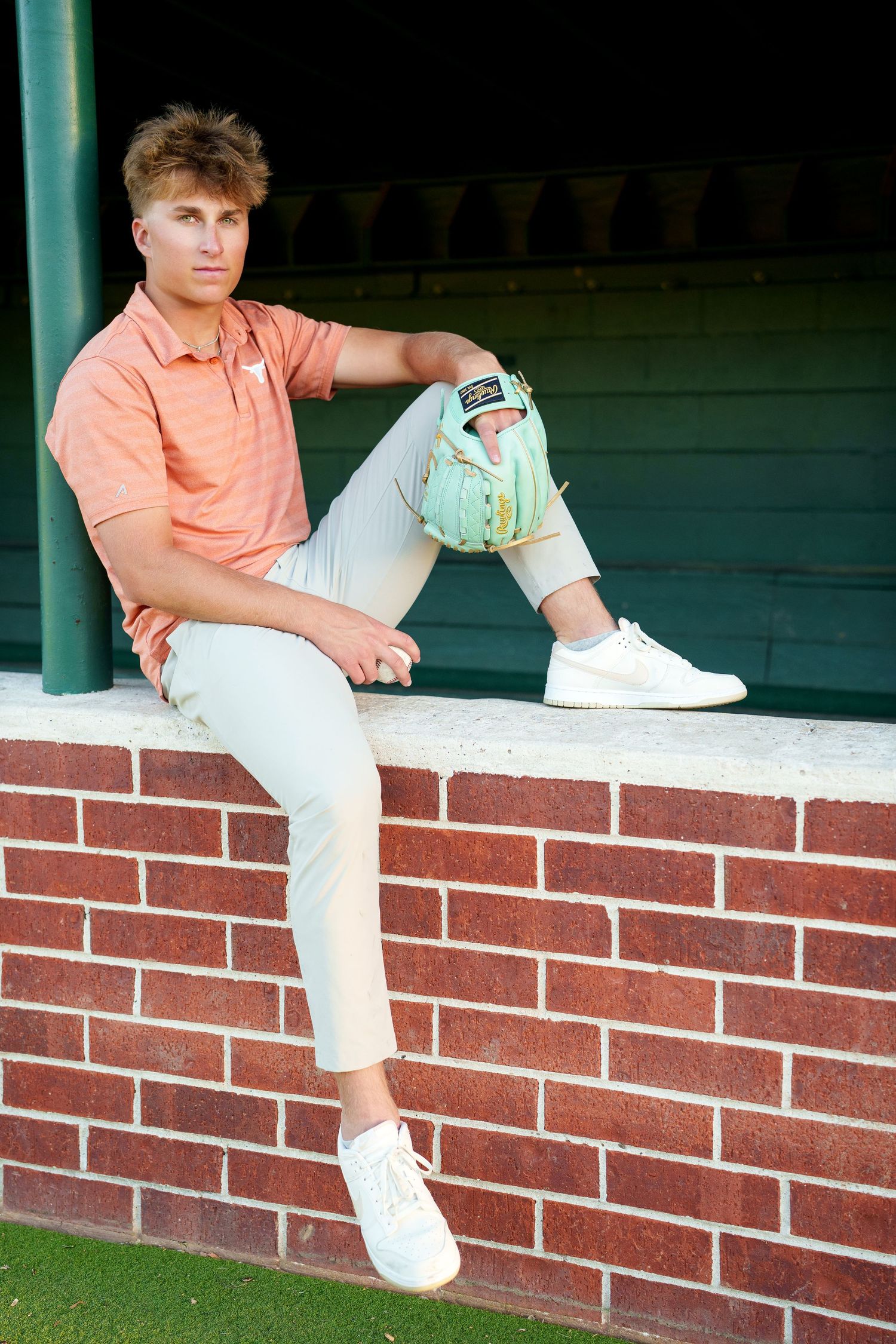 senior baseball dugout photos.  senior photographer the woodlands