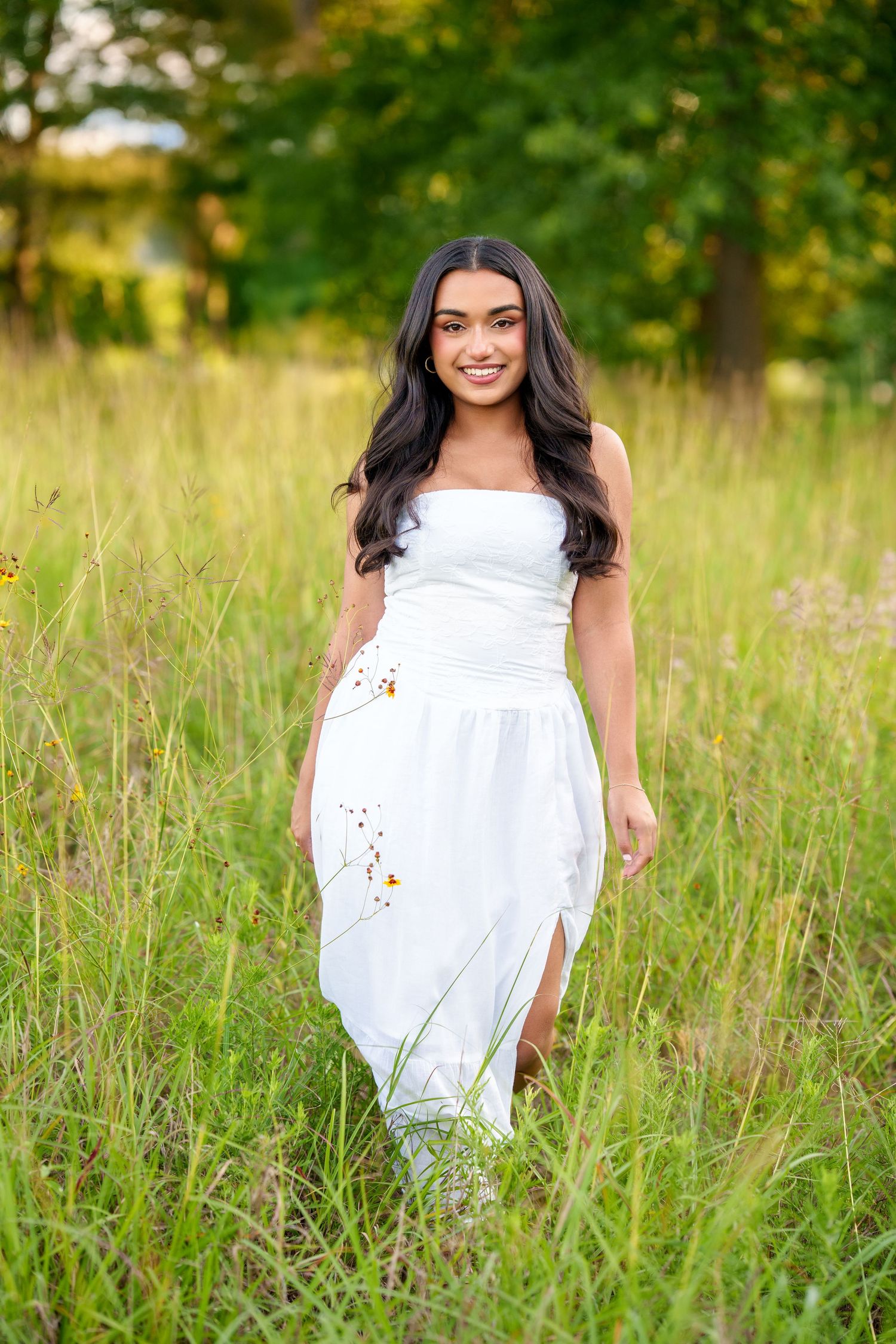 Senior photos in a field.  Tall grass nature senior session.  The best time to take senior photos in the Spring