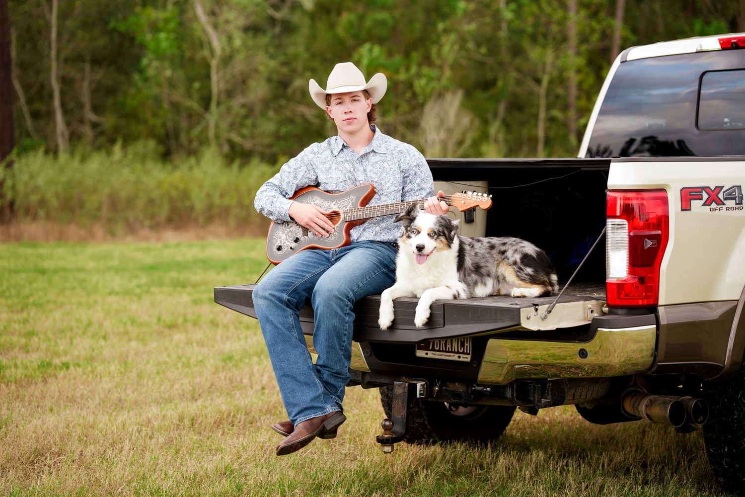 The Woodlands Senior Photographer.  Senior guy photos in the Woodlands.  sEnior guy with a dog, truck and guitar