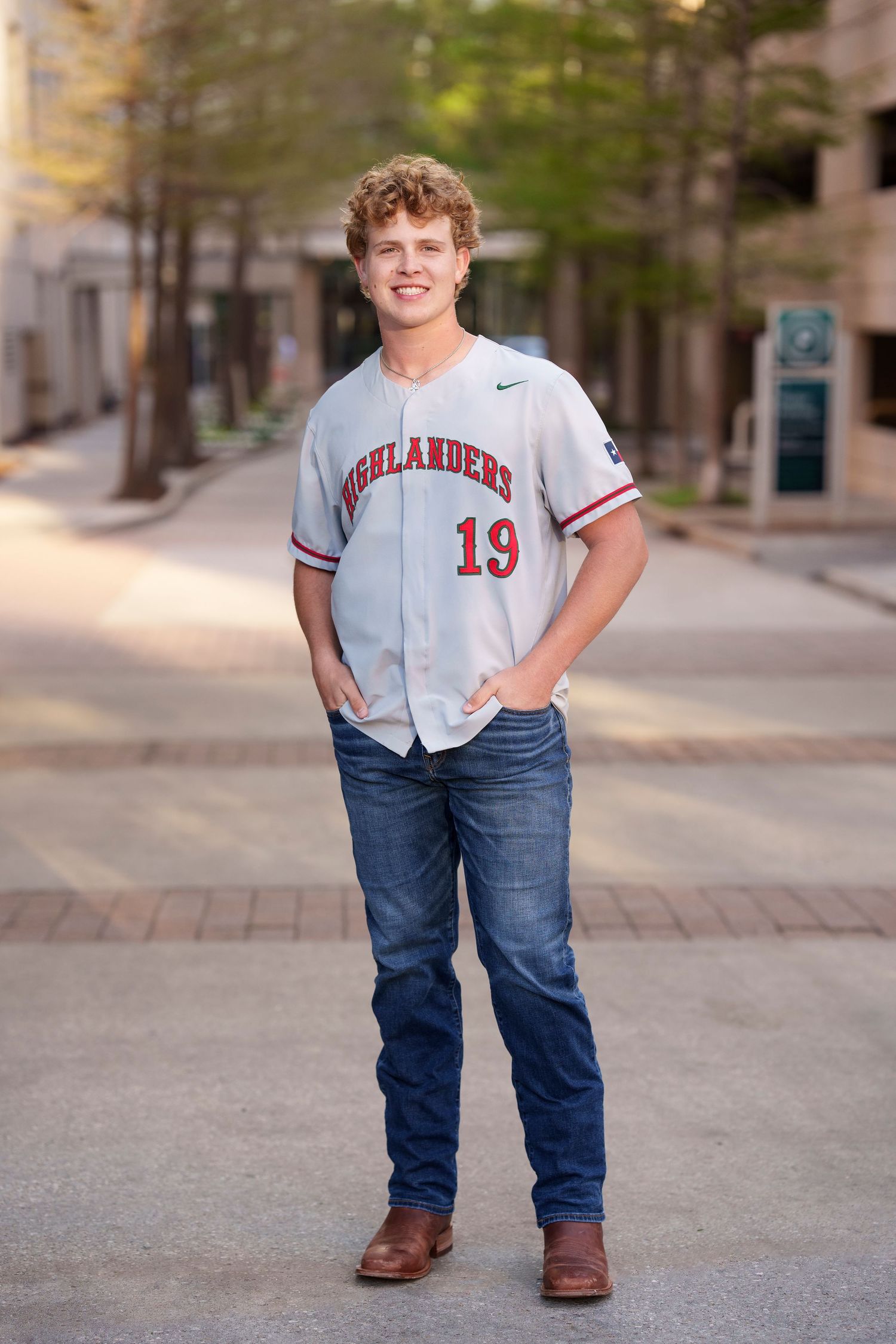 the woodlands baseball player senior photo on the street.  jersey senior photos