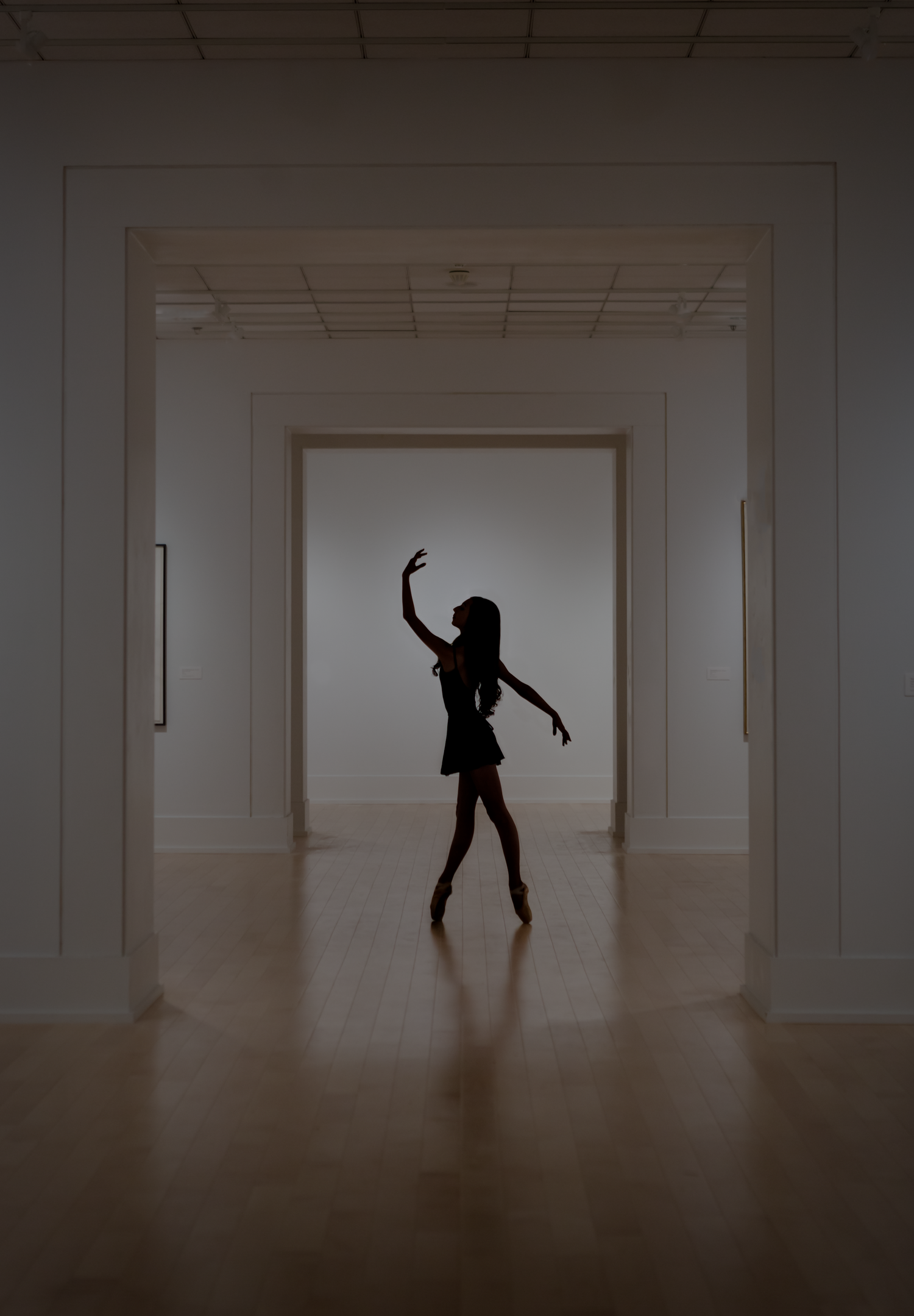 Silhouette of dancer in minimalist hallway — movement and stillness in cinematic contrast | Fine art conceptual photography by ja’nicole;art