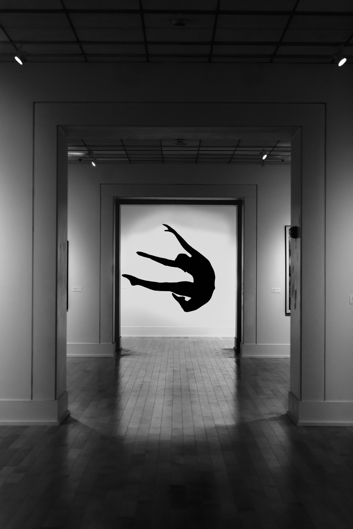 Silhouette of a dancer in minimalist light — graceful, timeless movement captured by ja'nicole;art