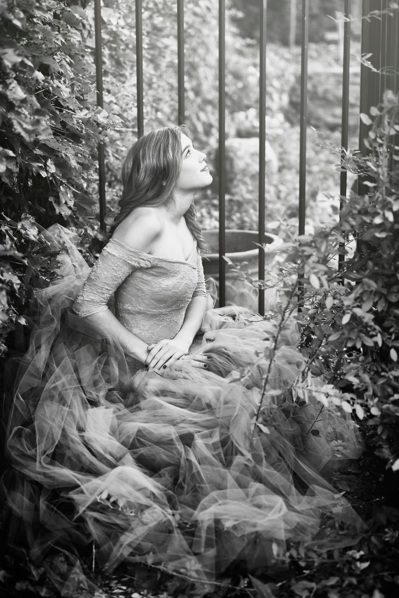 Emotional black-and-white fine art portrait — quiet reflection surrounded by forest light captured by ja’nicole;art