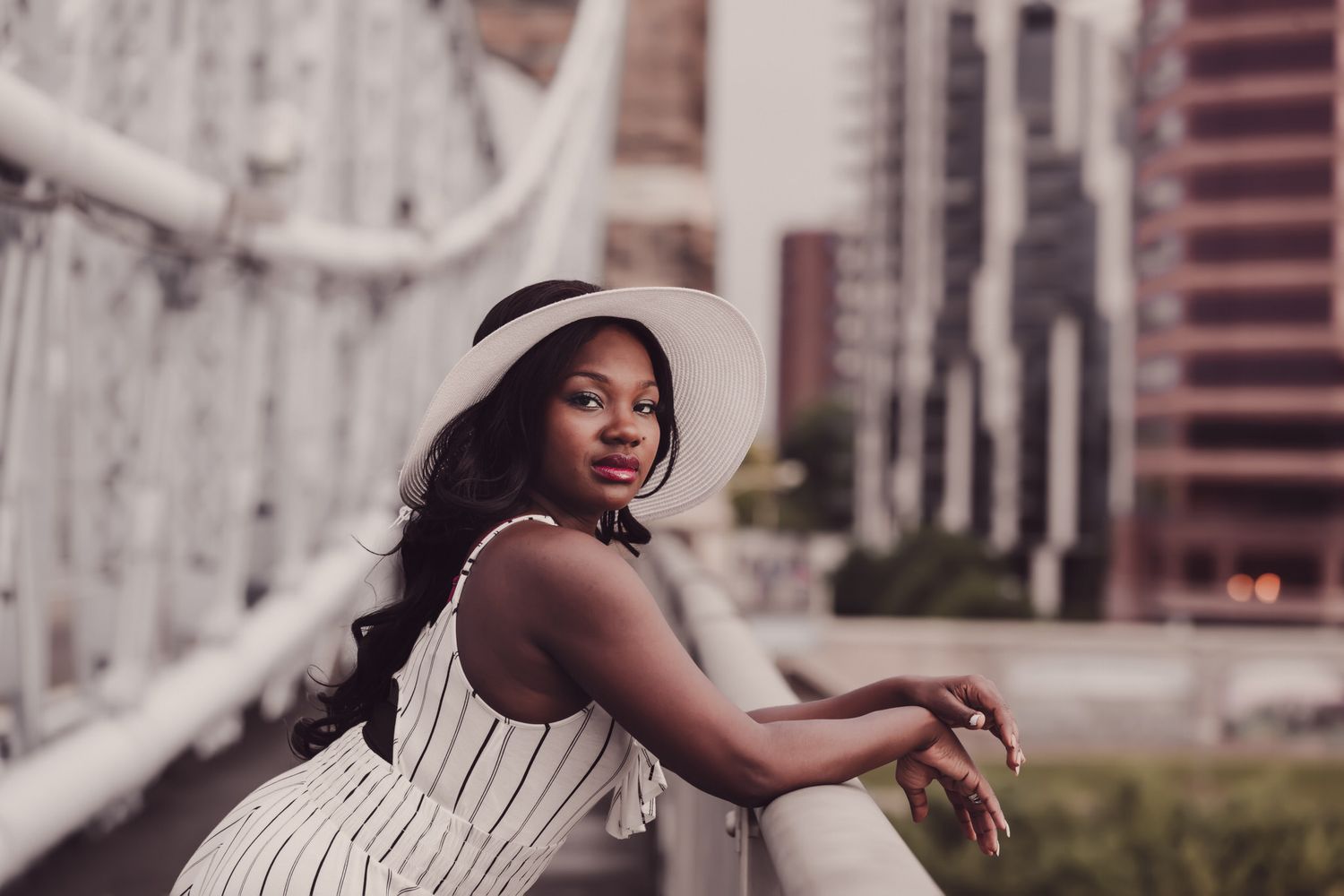Modern portrait blending fine art and lifestyle photography — joy and authenticity in urban light captured by ja’nicole;art