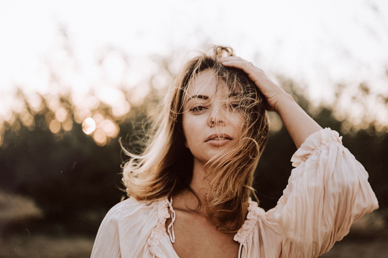 Ethereal portrait series in soft lighting with flowing white fabric.