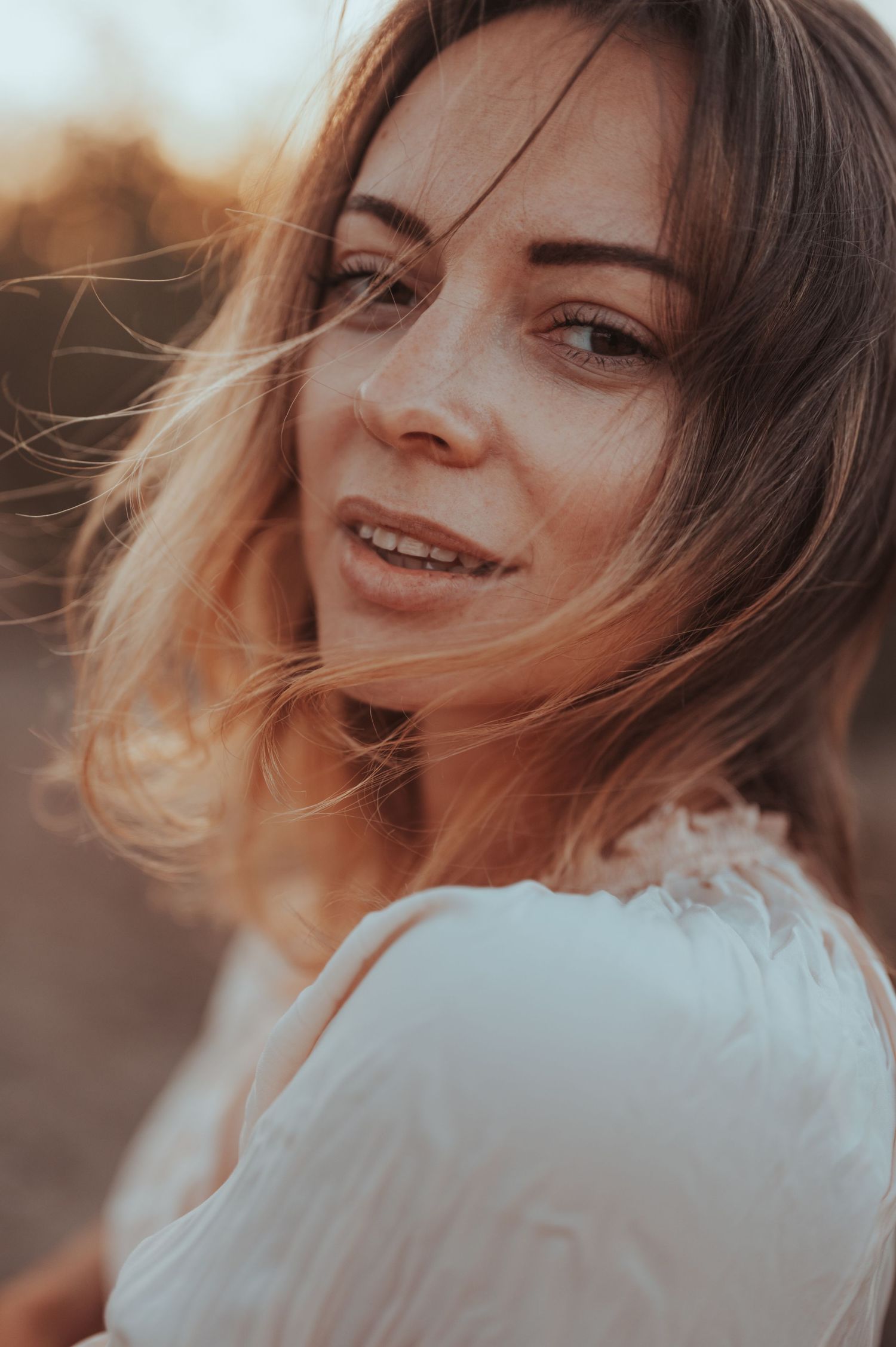 Close-up portrait sequence with joyful expressions and warm sunset glow.