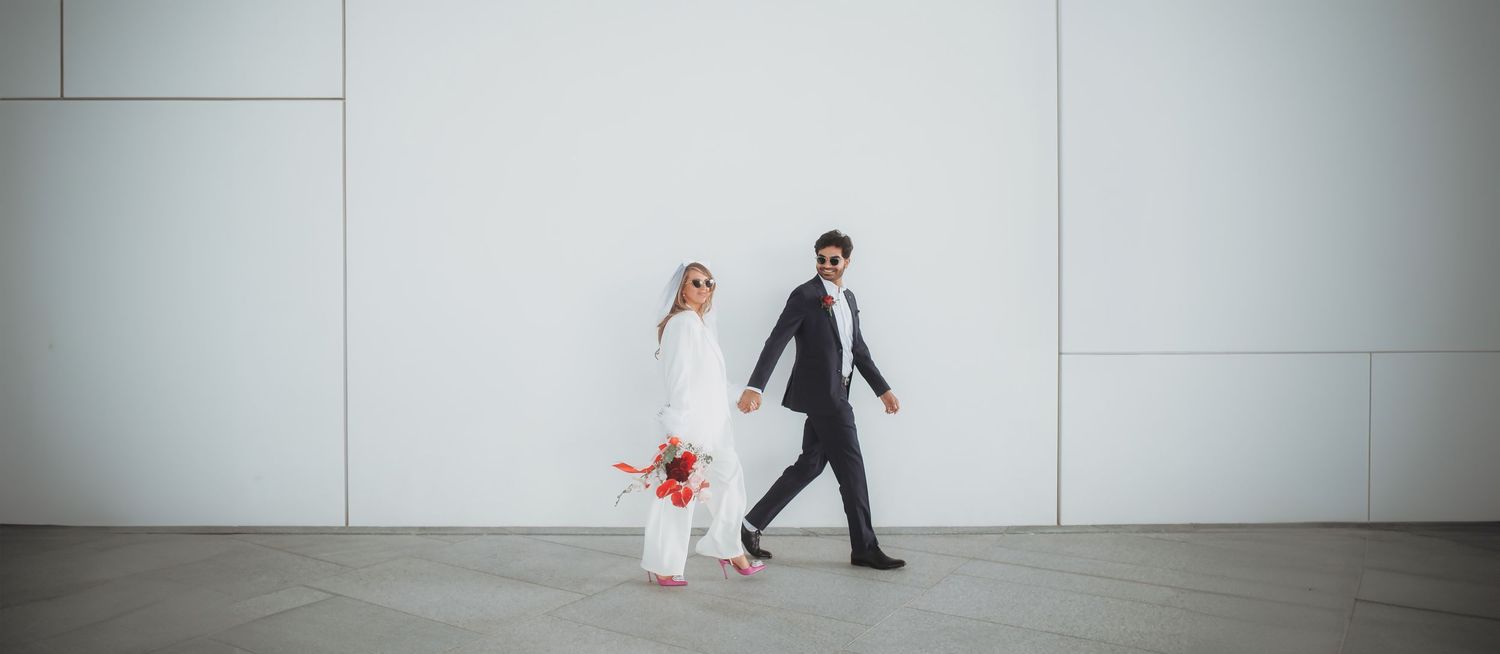 Modern wedding photography sequence showing couple's movement in a minimalist white space.