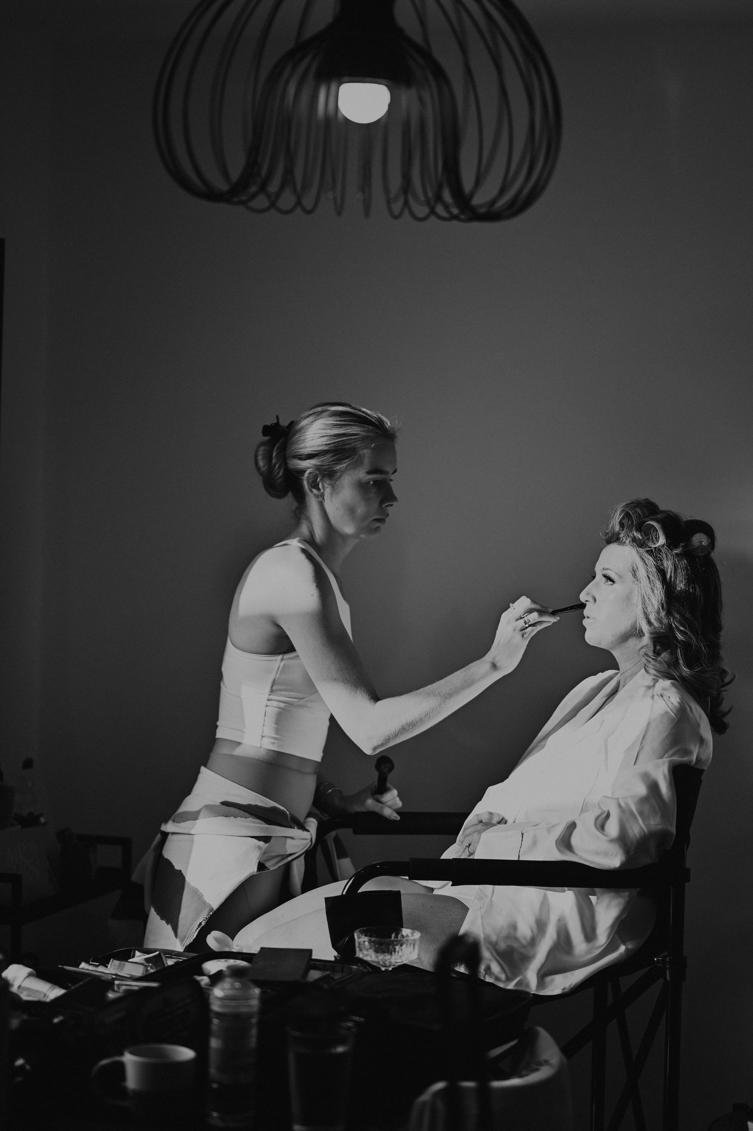 Monochromatic photos showing a spa treatment or beauty service in progress.