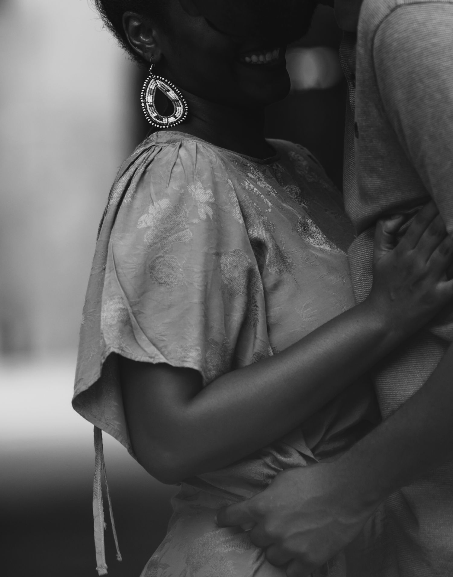 Intimate black and white portrait of a couple sharing a close moment.