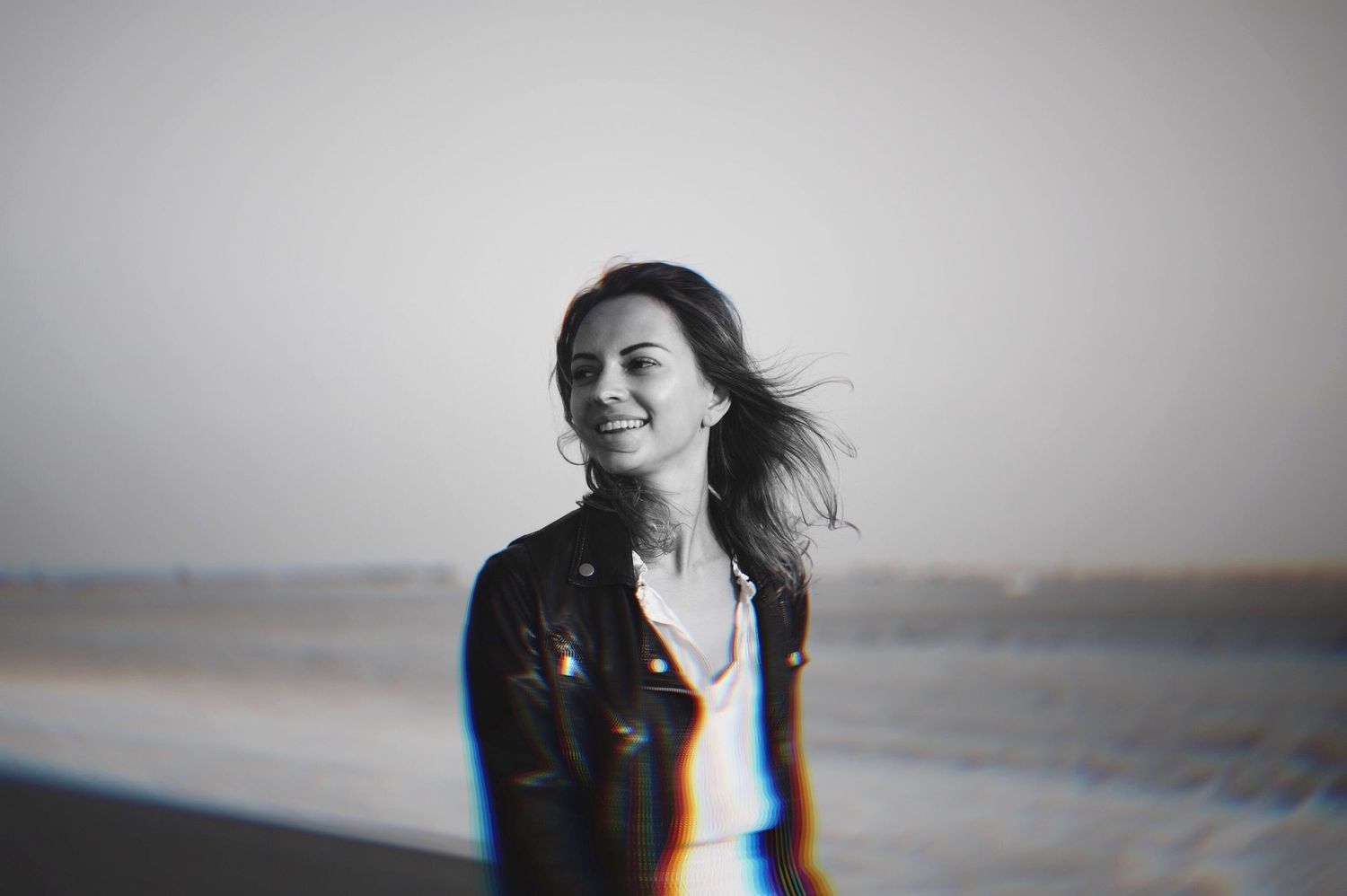 Black and white portrait series showing joyful expressions and movement.