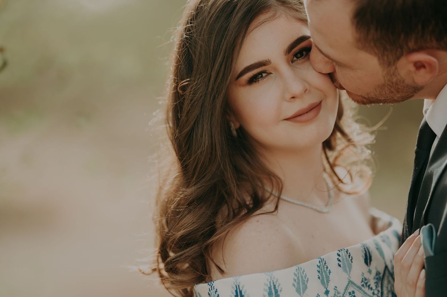 Romantic wedding photography sequence capturing intimate moments and an embroidered white gown.
