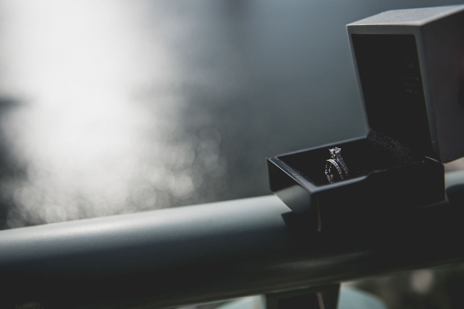 Abstract blurred dark background with soft bokeh lighting effects.