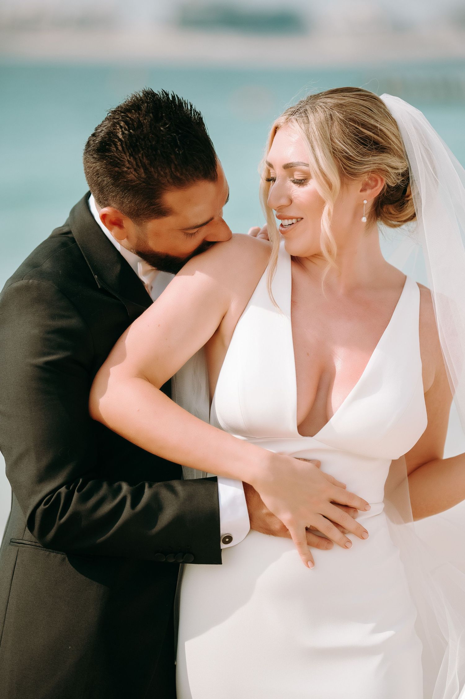 Intimate wedding portrait sequence with couple embracing in soft lighting.