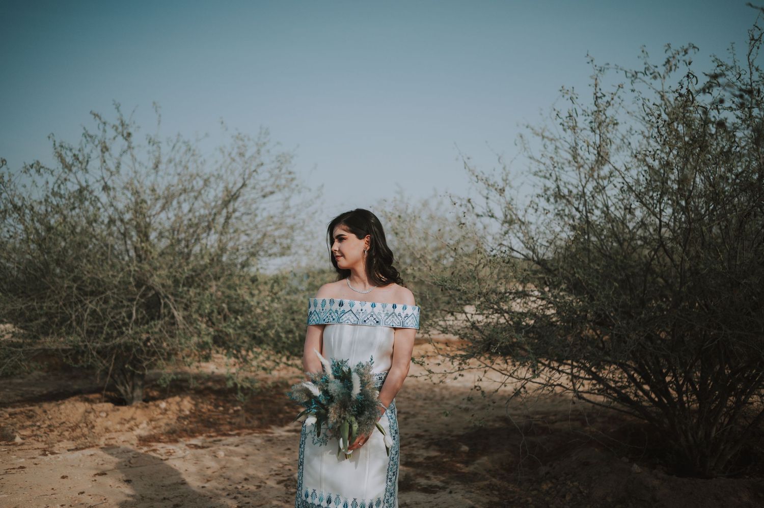 A romantic desert engagement session with soft lighting and natural scenery.
