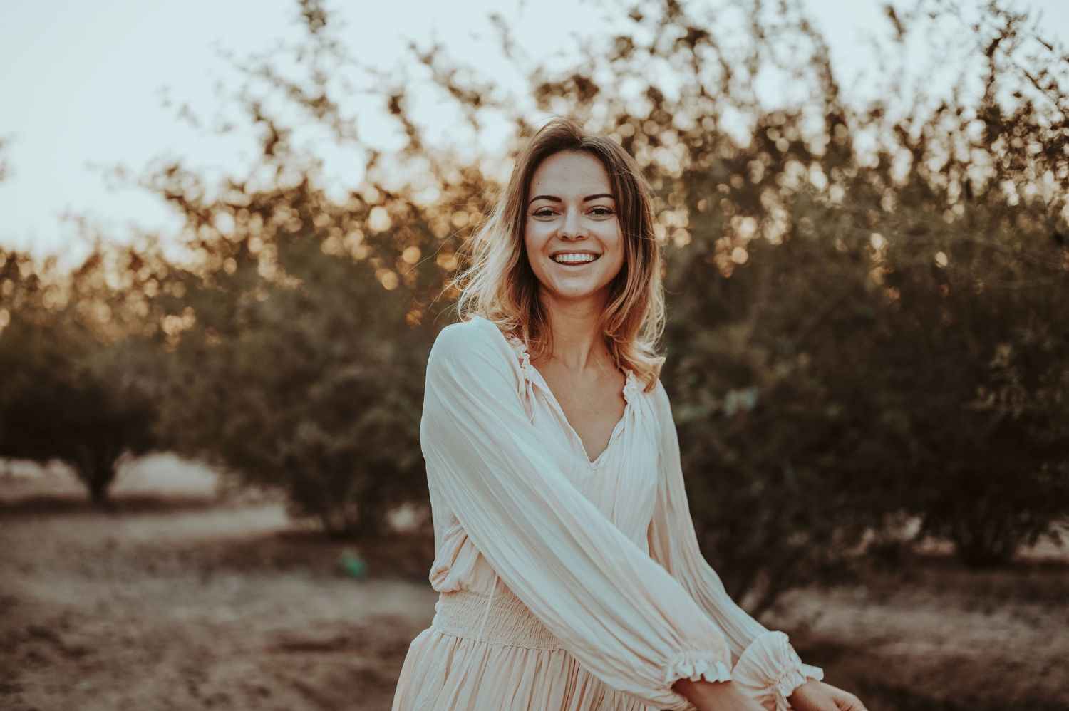Candid portrait series with warm autumn lighting and white clothing.