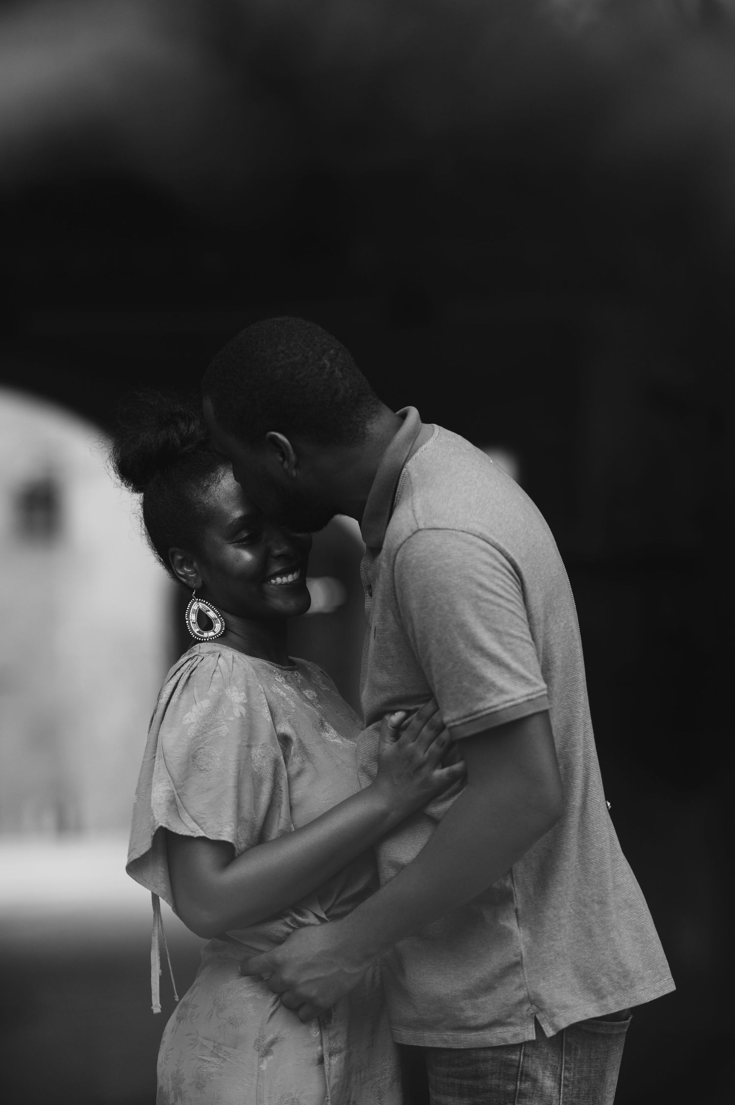 Black and white photo series capturing tender moments between a couple.