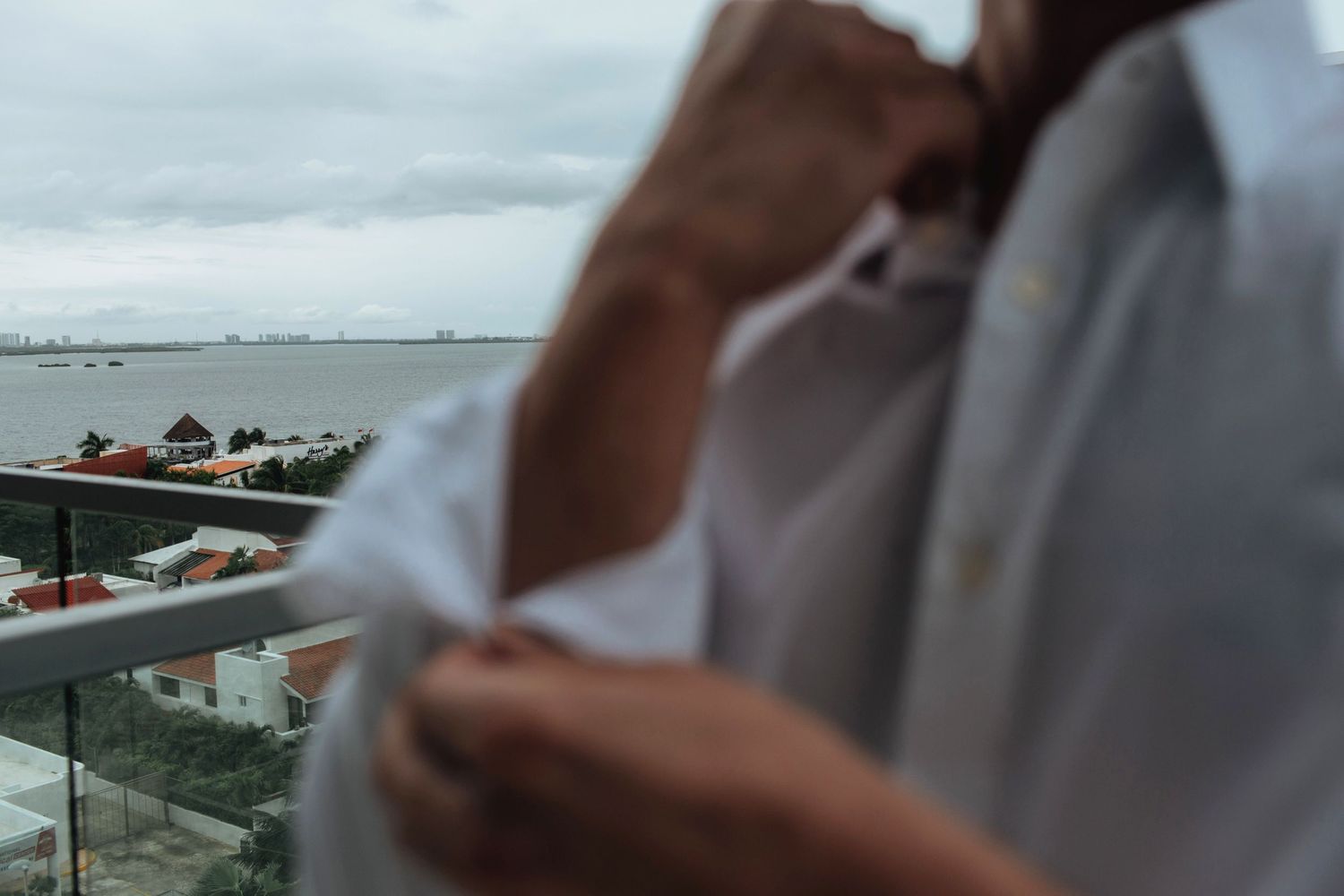 Cloudy oceanfront view from a high-rise building.