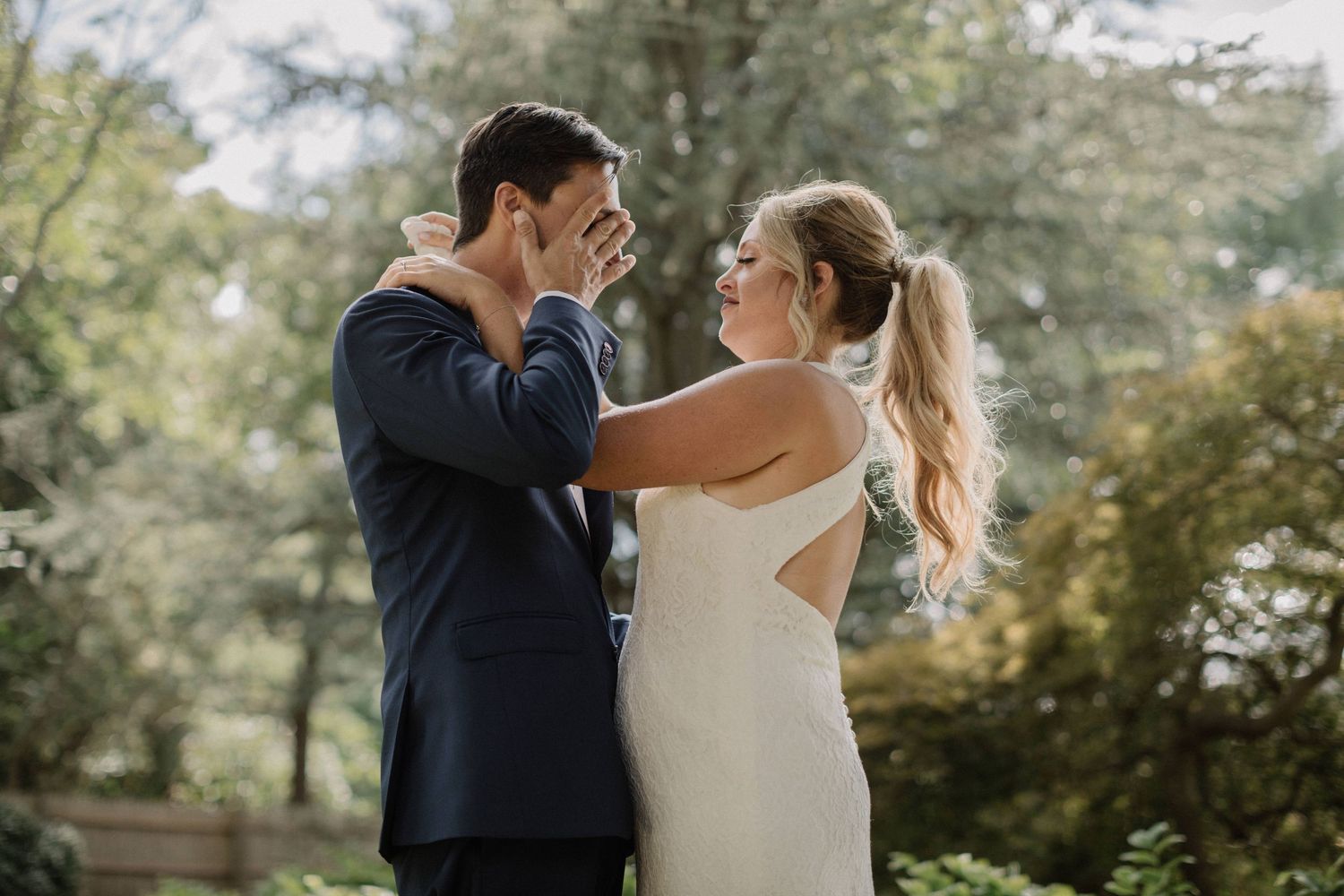 Romantic outdoor wedding photos captured in a natural garden setting.