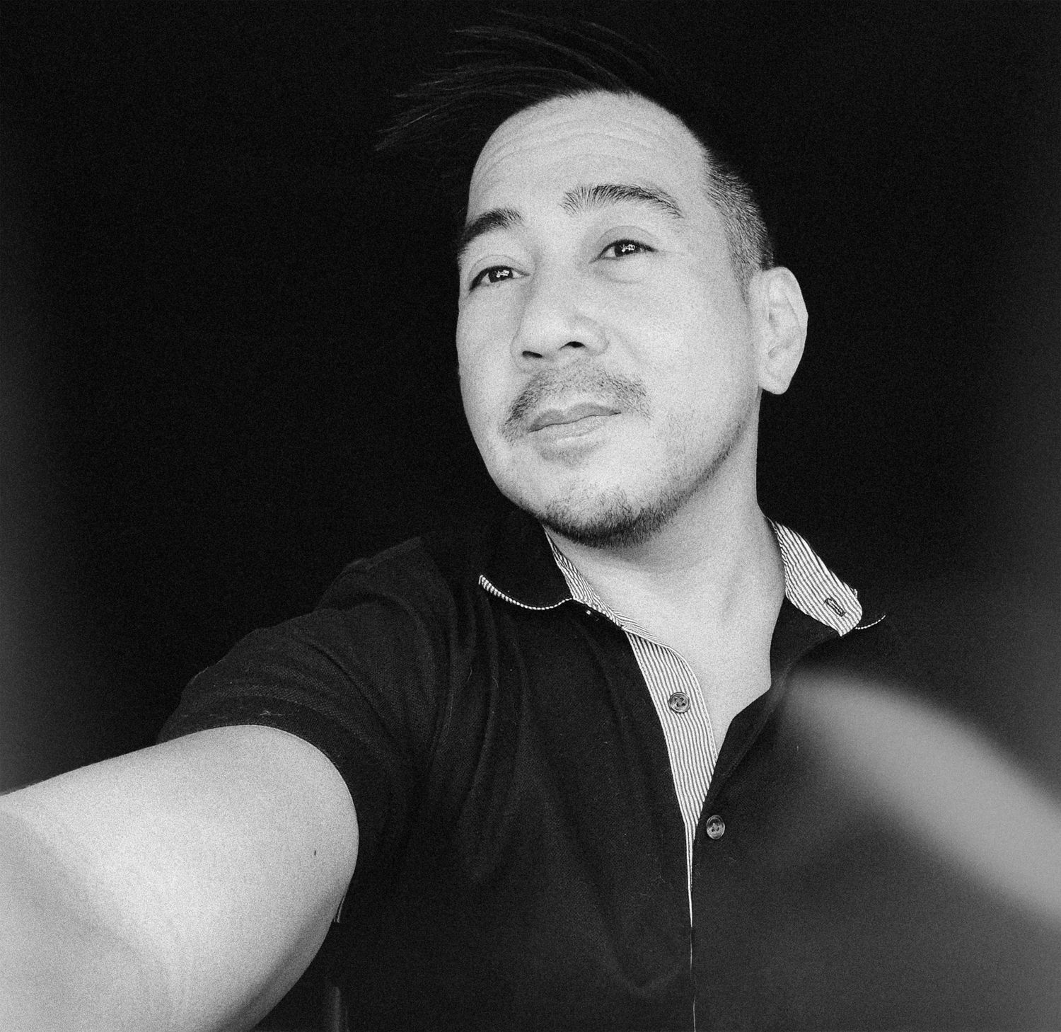 Series of black and white selfie portraits showing different angles and expressions.