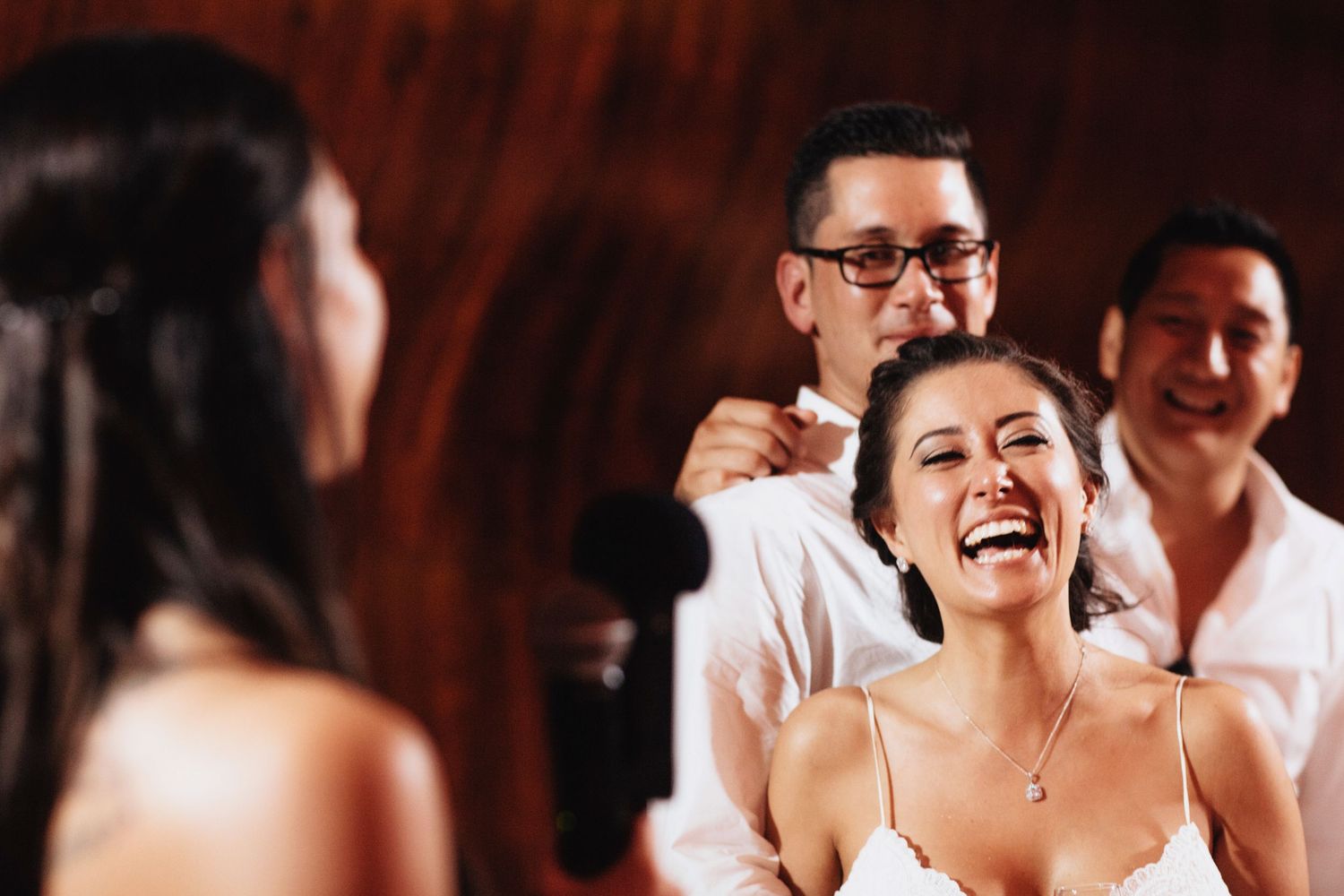Joyful celebration moments captured during a wedding reception dance.