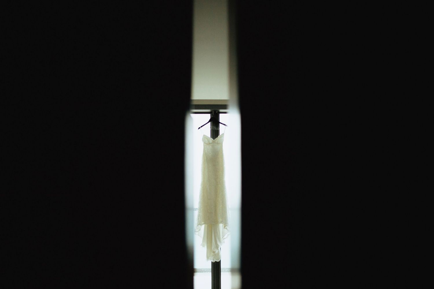 Bright doorway silhouettes against dark interior spaces.