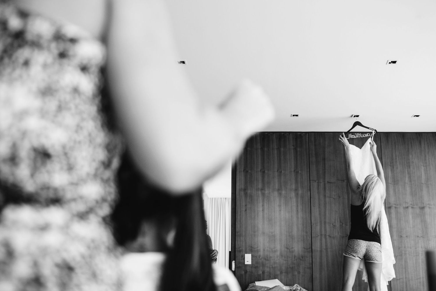 Blurred black and white images showing movement in an interior space.