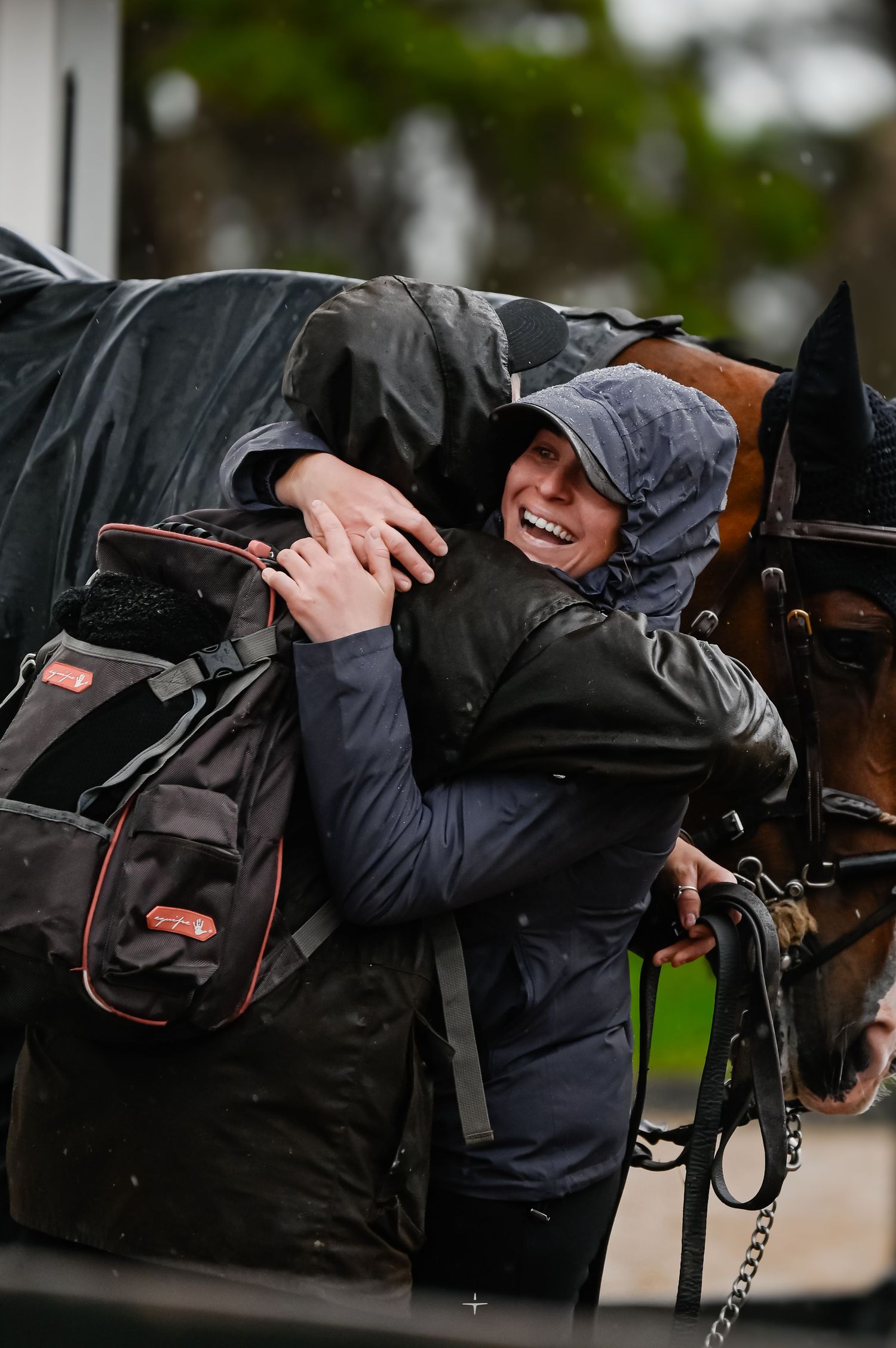 Close-up sequence of a person adjusting equipment on a horse's bridle and saddle in an outdoor setting.