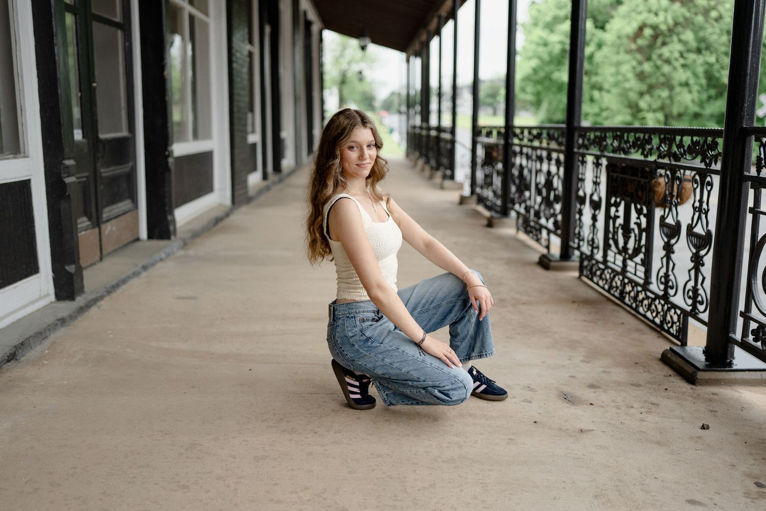 Artistic photographs taken in a vintage colonnade with ornate iron railings.