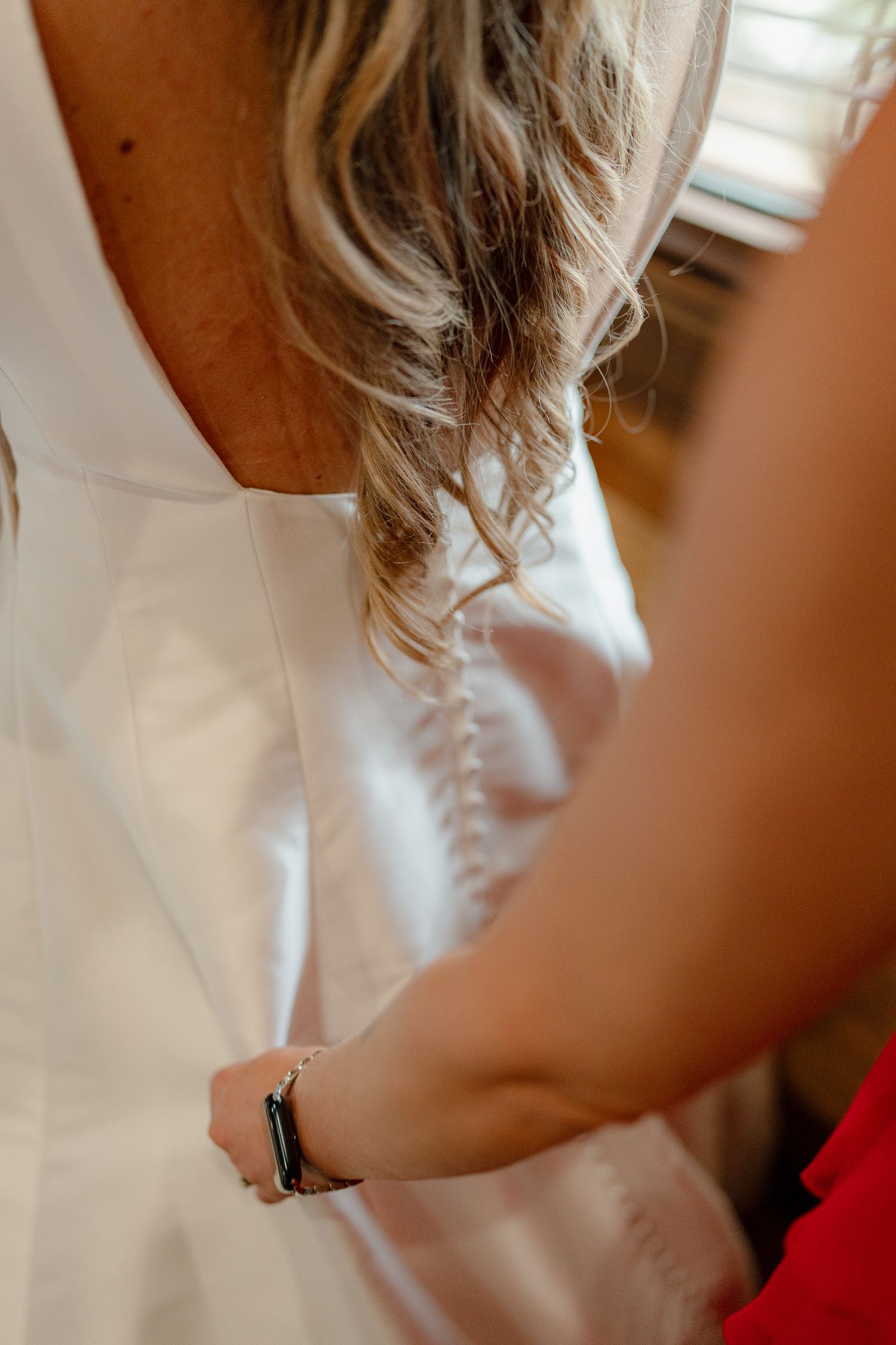 Close-up view of wavy blonde hair with soft natural highlights cascading down in an elegant style.