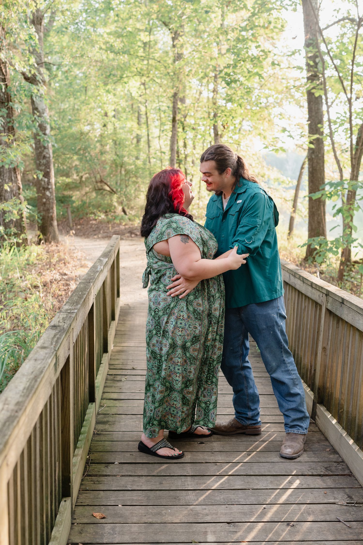Couple sharing tender moments in a sequence of photos on a wooden boardwalk surrounded by autumn trees.