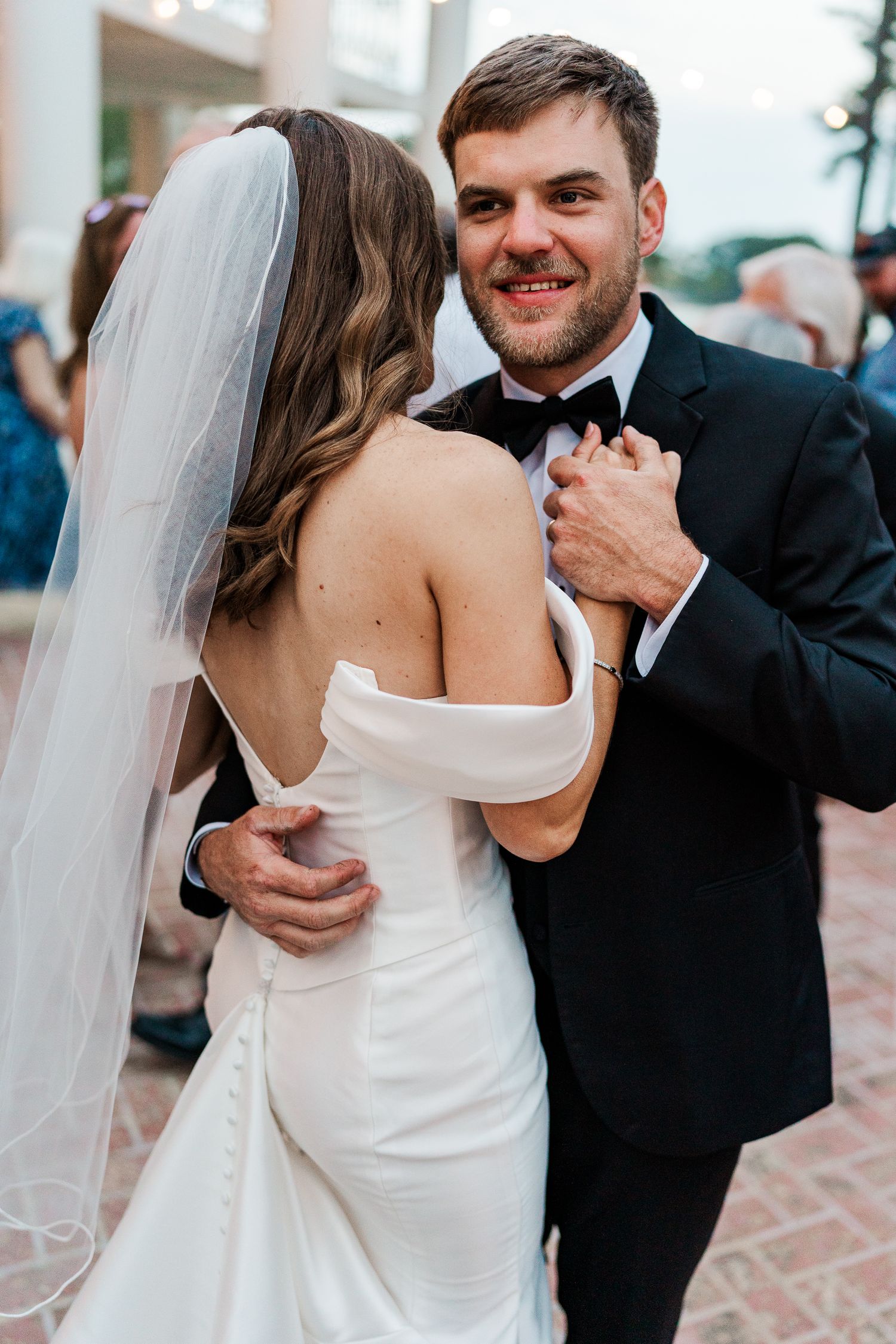 Couple sharing a romantic dance moment at their wedding reception.