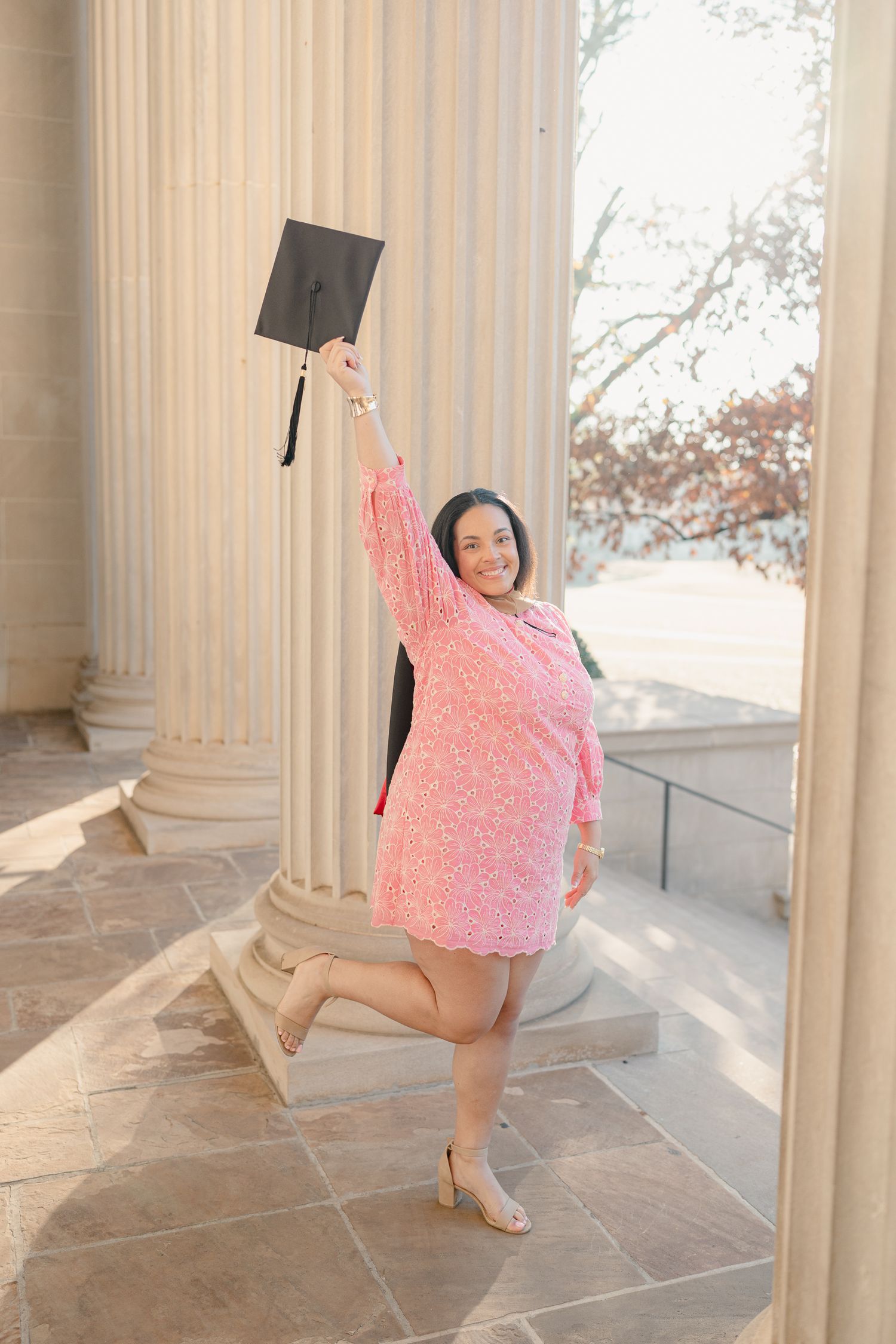 A series of graduation celebration photos with pink dress and cap between classical columns.