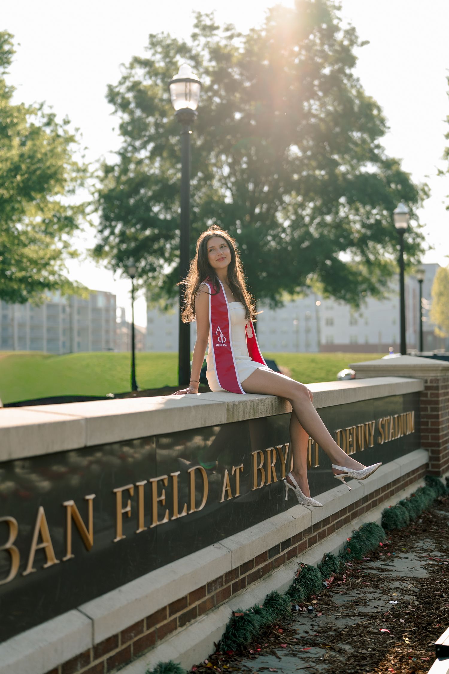 A series of sunset photos showing someone sitting on a brick wall with text reading 'Dan Field' in golden sunlight.