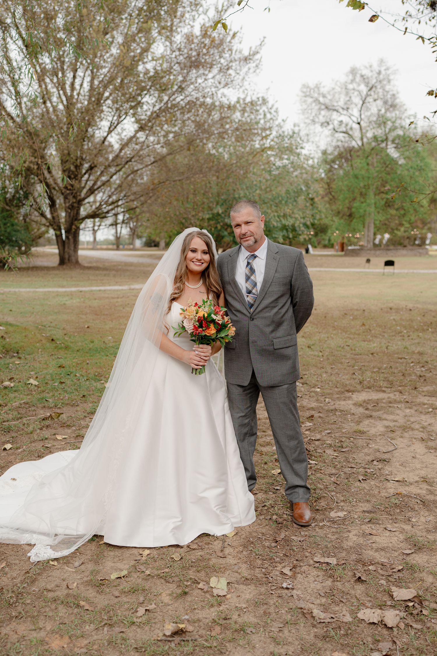 Romantic outdoor wedding photography sequence showing a couple posing together under autumn trees.