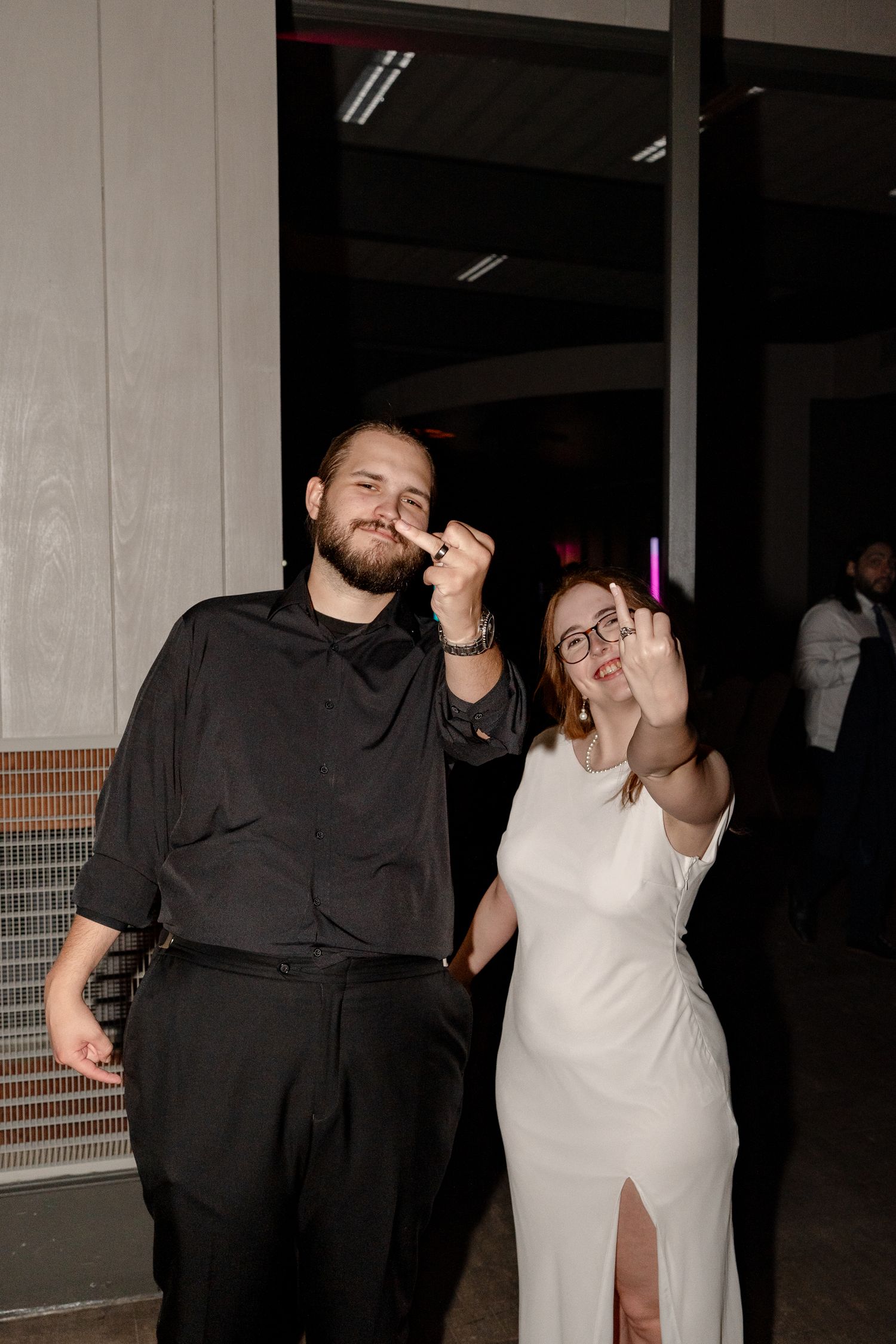 Wedding guests enjoying the celebration and dancing at an evening reception.