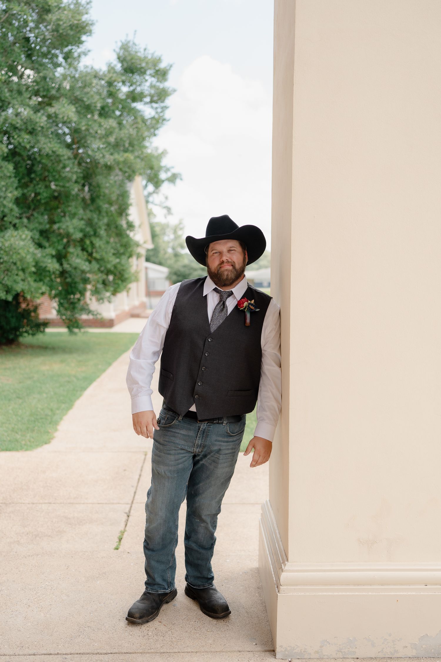 A series of four similar photos showing someone in western attire with cowboy hat and vest standing against a light wall.