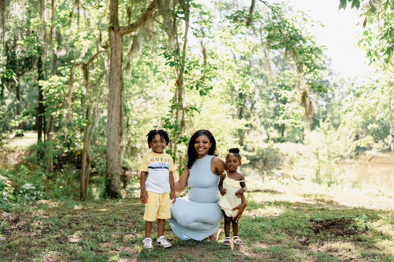 Small group enjoys a casual moment together in a peaceful wooded setting.