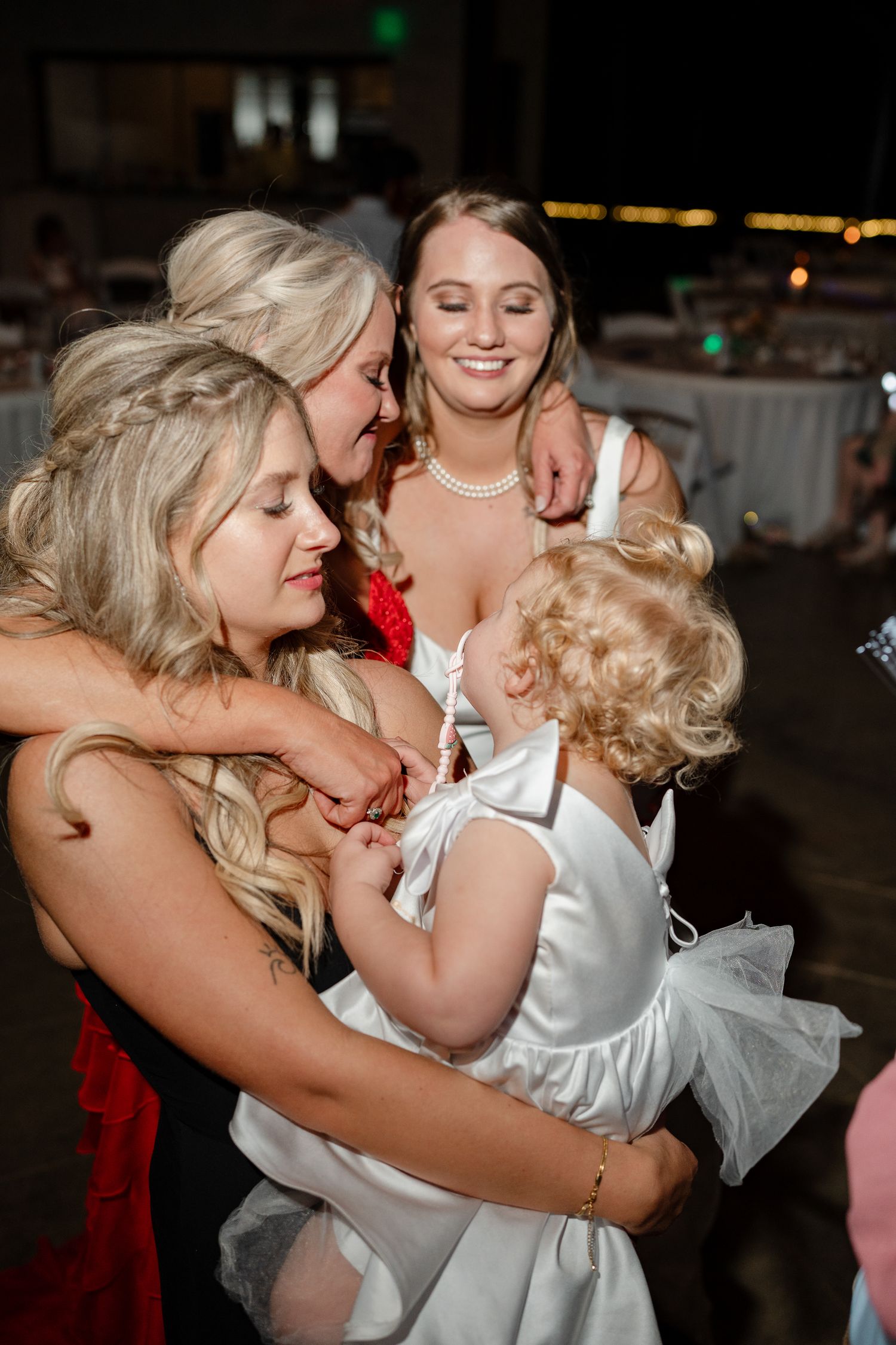 Joyful moment shared between wedding guests during reception celebrations.
