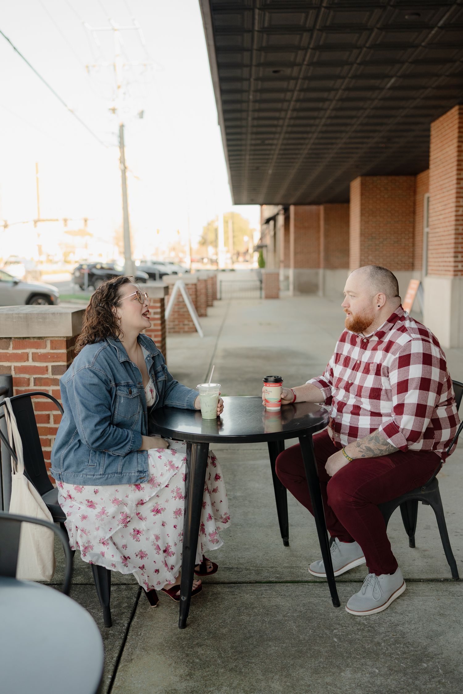 A couple sits at outdoor tables having a candid conversation in a series of connected photos showing different angles.